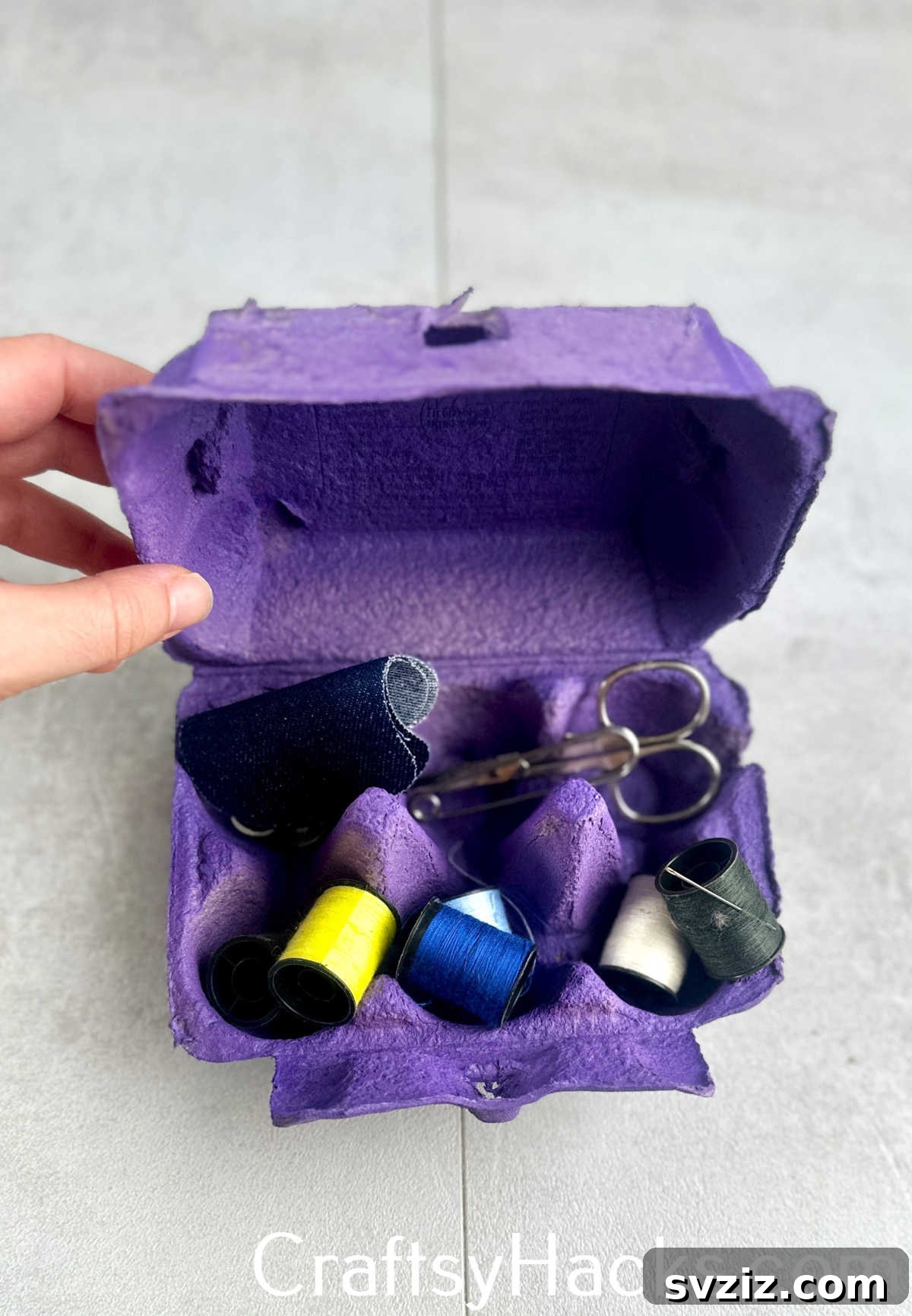 Repurpose an empty egg carton to neatly organize small sewing notions like thread spools, buttons, and thimbles.