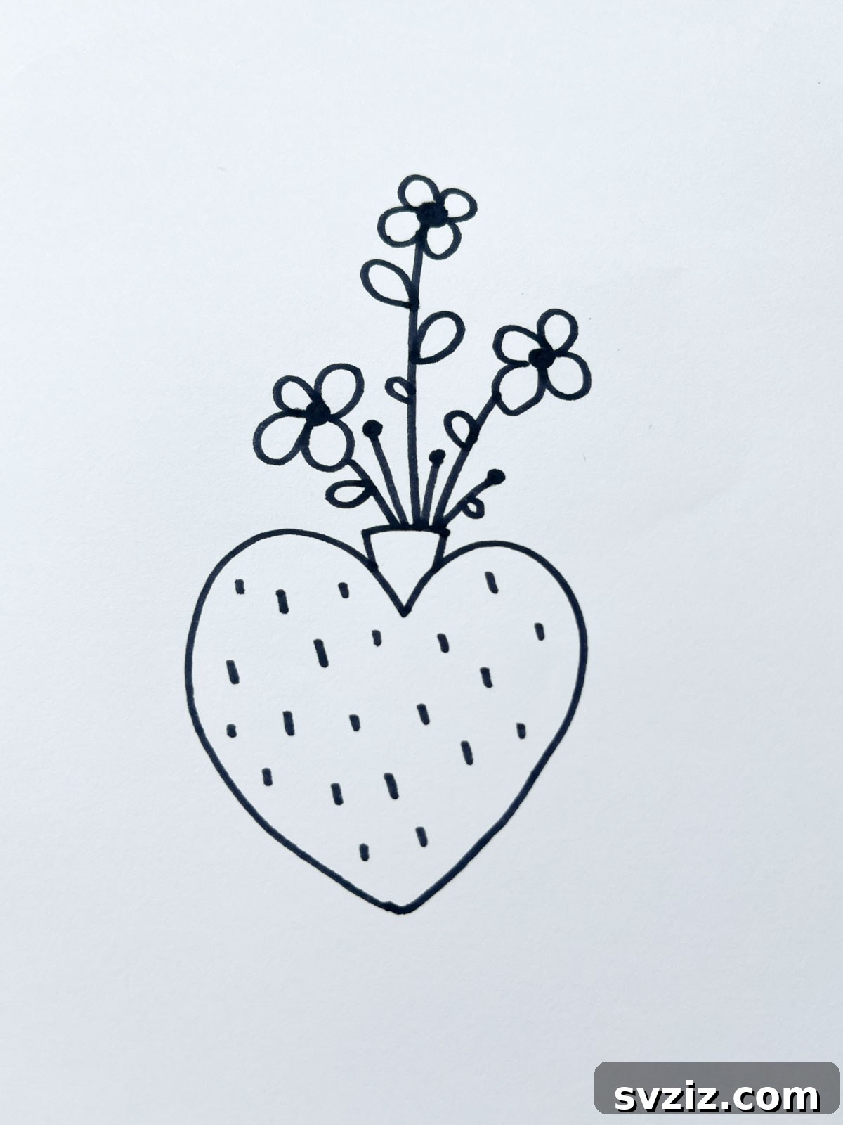 A creative heart-shaped flower pot drawing with a plant growing inside.