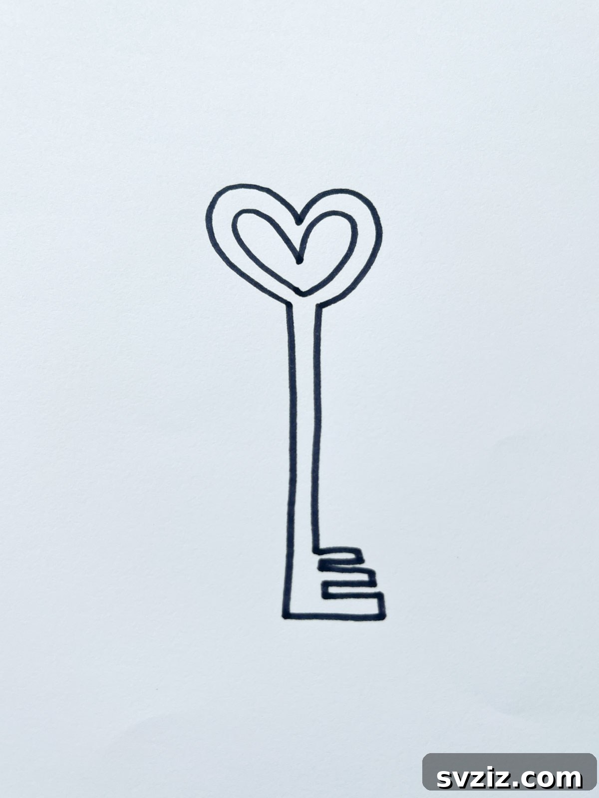 A classic 'key to my heart' drawing, featuring a detailed key and a heart-shaped keyhole.