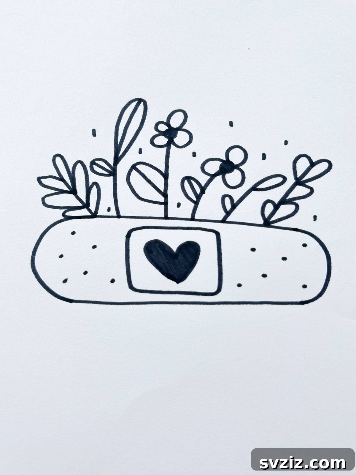 A creative drawing of a band-aid with a heart design, symbolizing healing and care.