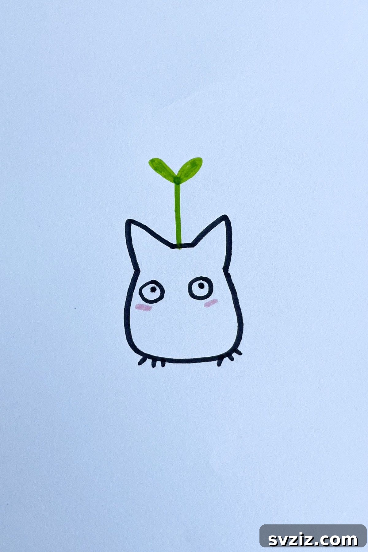 Effortless Anime Art: 31 Drawing Prompts 15 Anime drawing of a small, white Totoro Sprout from My Neighbor Totoro, a cute and simple forest spirit with a leaf on its head.