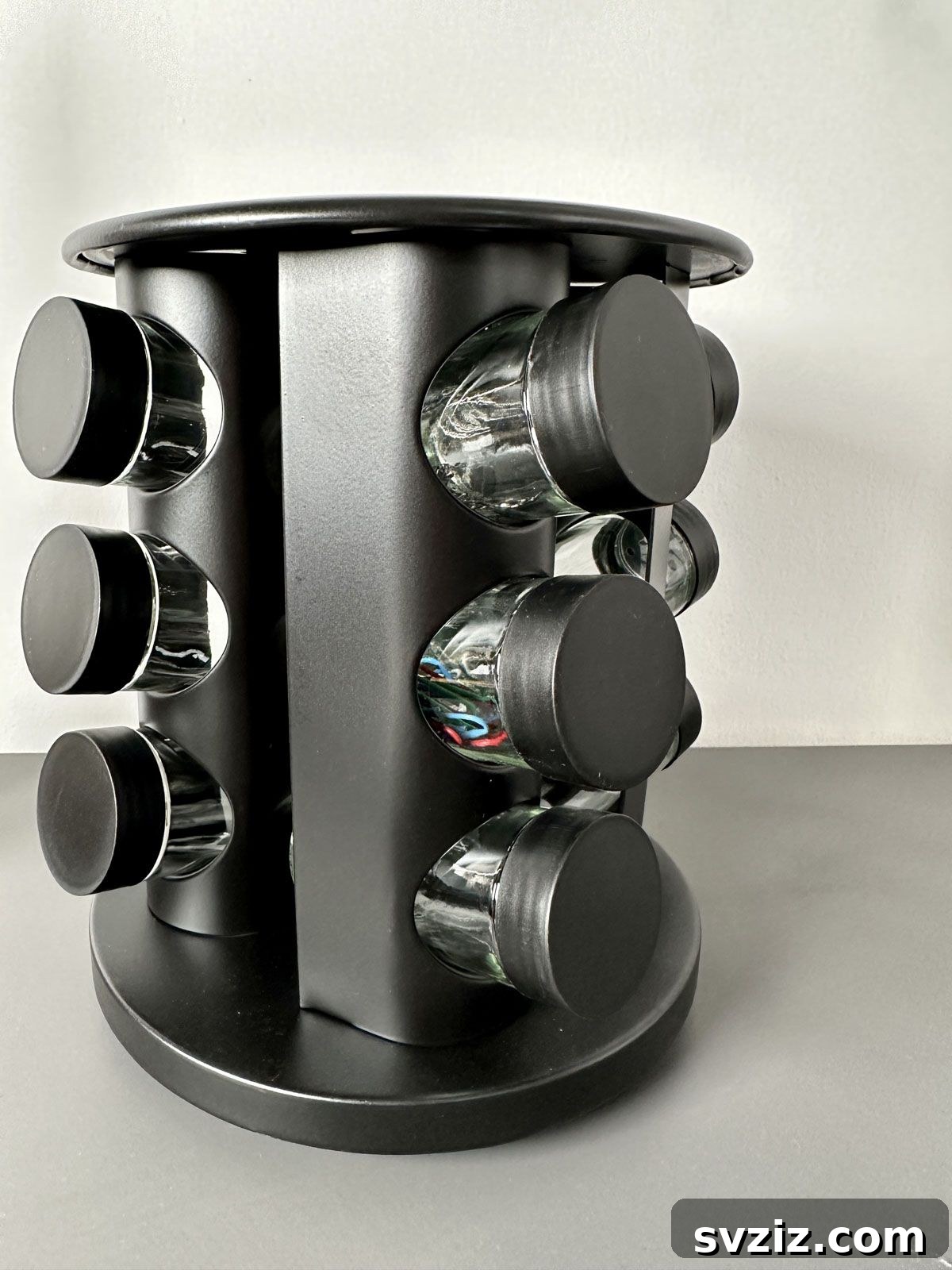 Use a Spice Rack to Contain Small Office Supplies