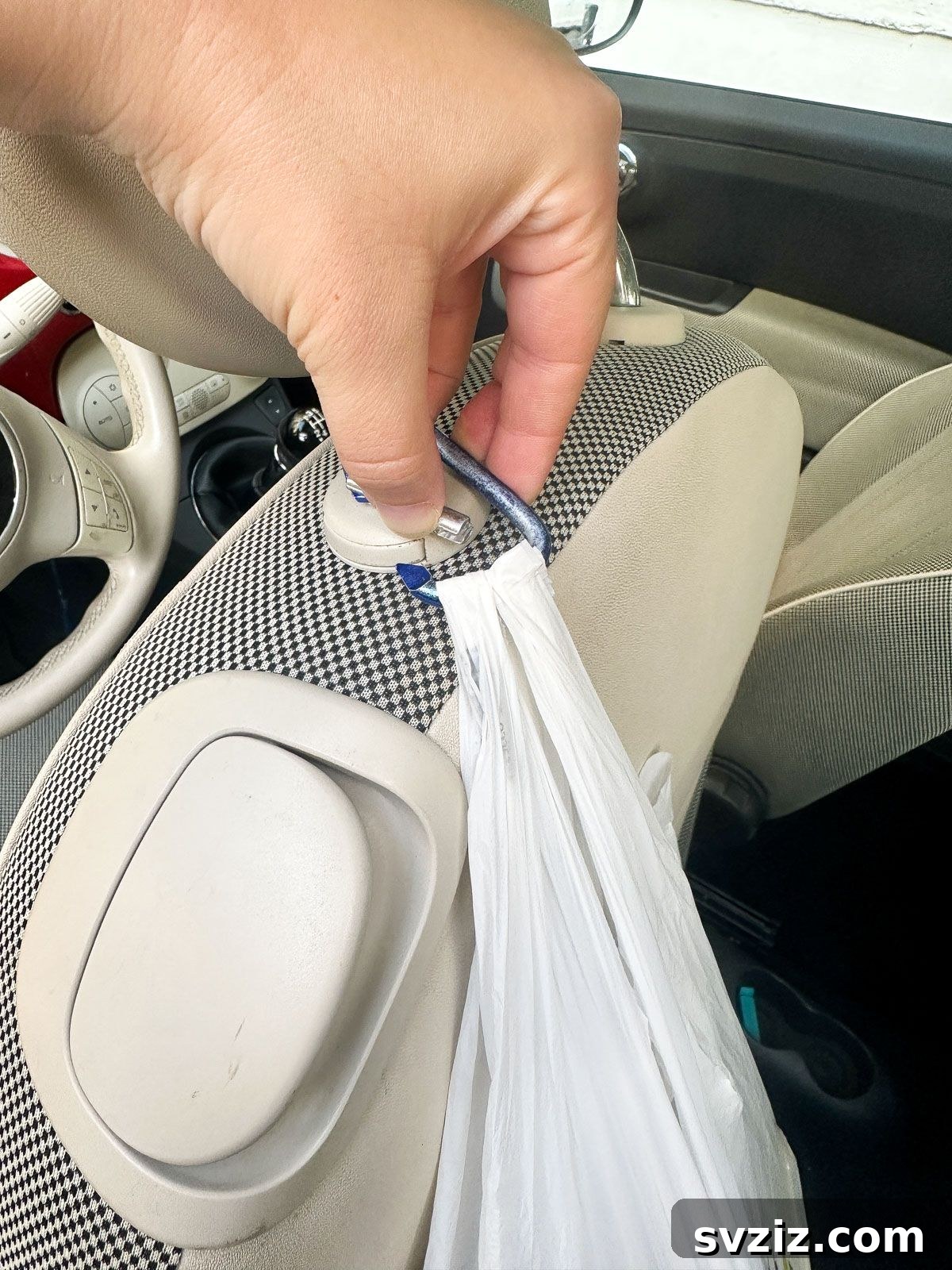 Effortless Driving: 21 Brilliant Car Hacks You Need 10 Use a Carabiner on the Headrest Support to Hang Bags