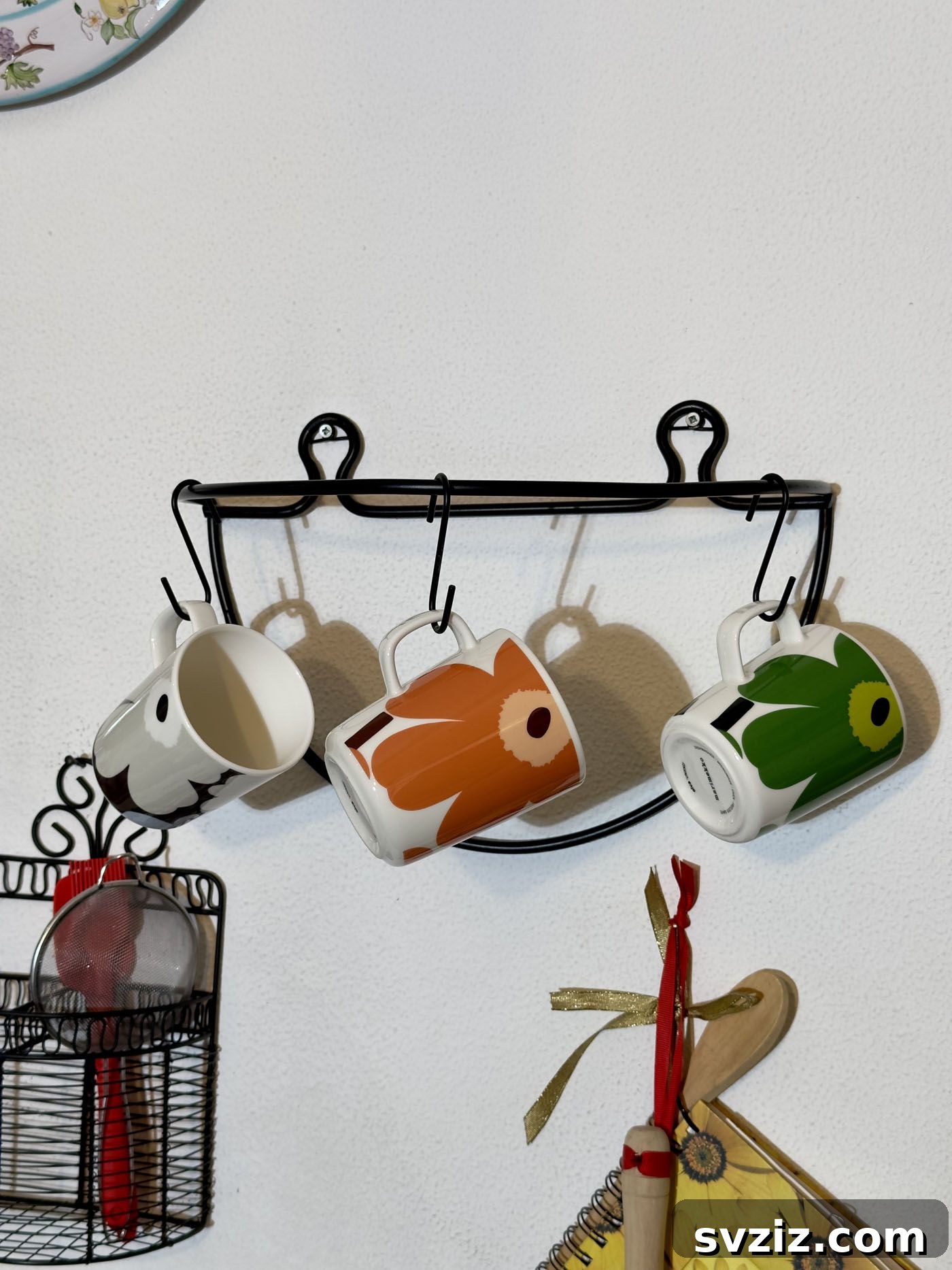 21 Creative Kitchen Organization Ideas 23 Mugs hanging on hooks above a coffee station