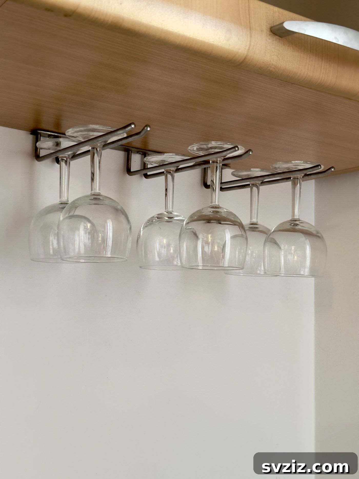 21 Creative Kitchen Organization Ideas 6 Wine glasses stored upside down under a cabinet