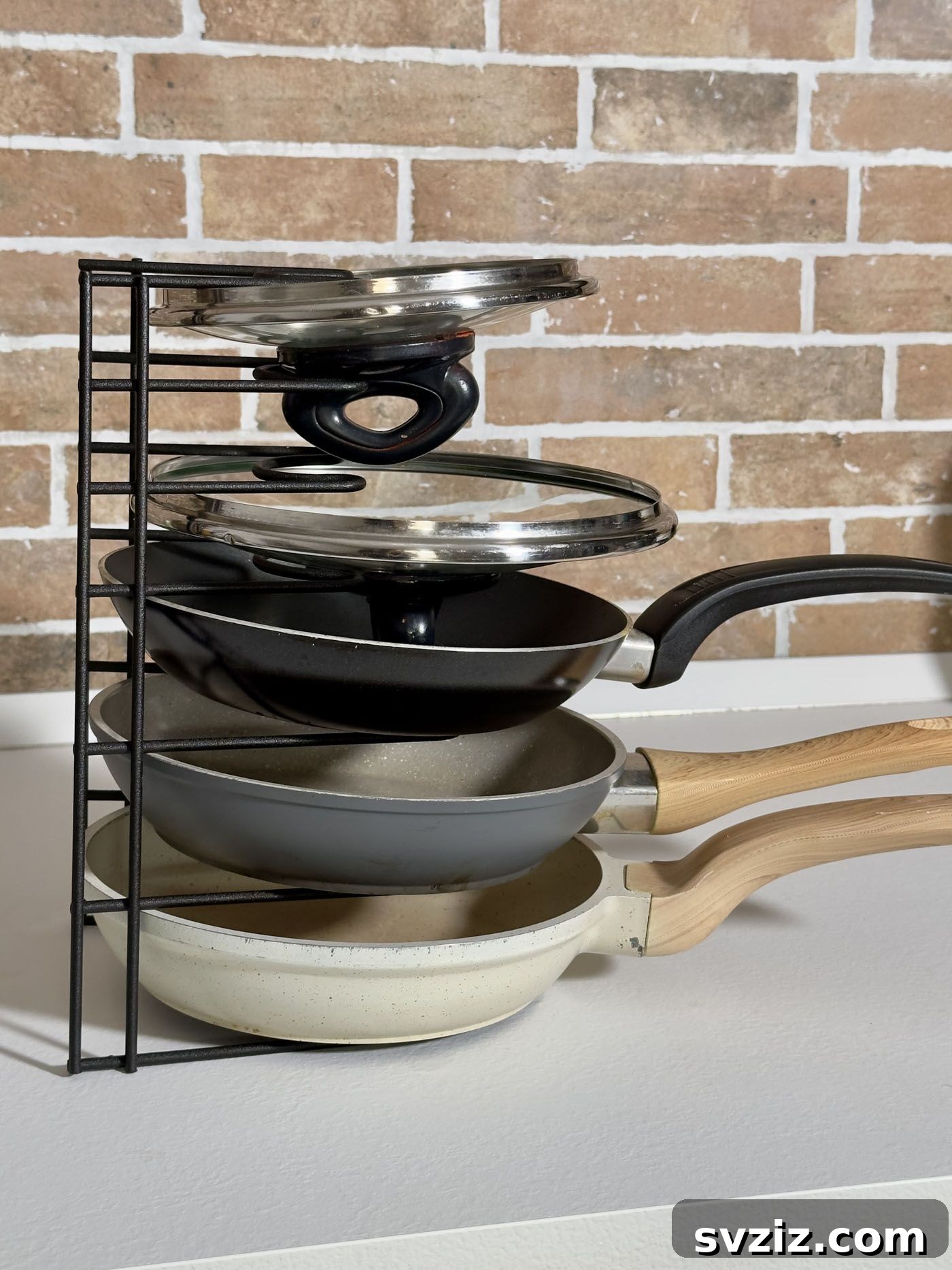 21 Creative Kitchen Organization Ideas 8 Pots and pan lids organized with a divider