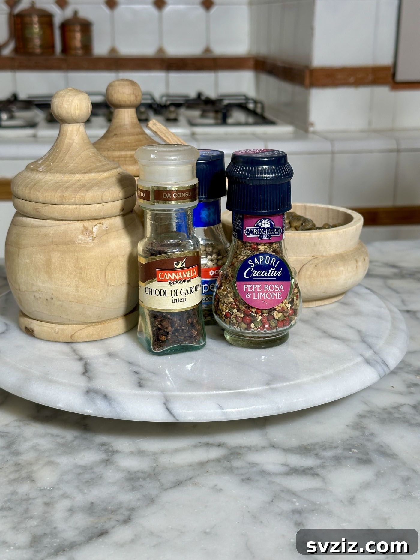 21 Creative Kitchen Organization Ideas 10 Lazy Susan holding kitchen essentials on a countertop