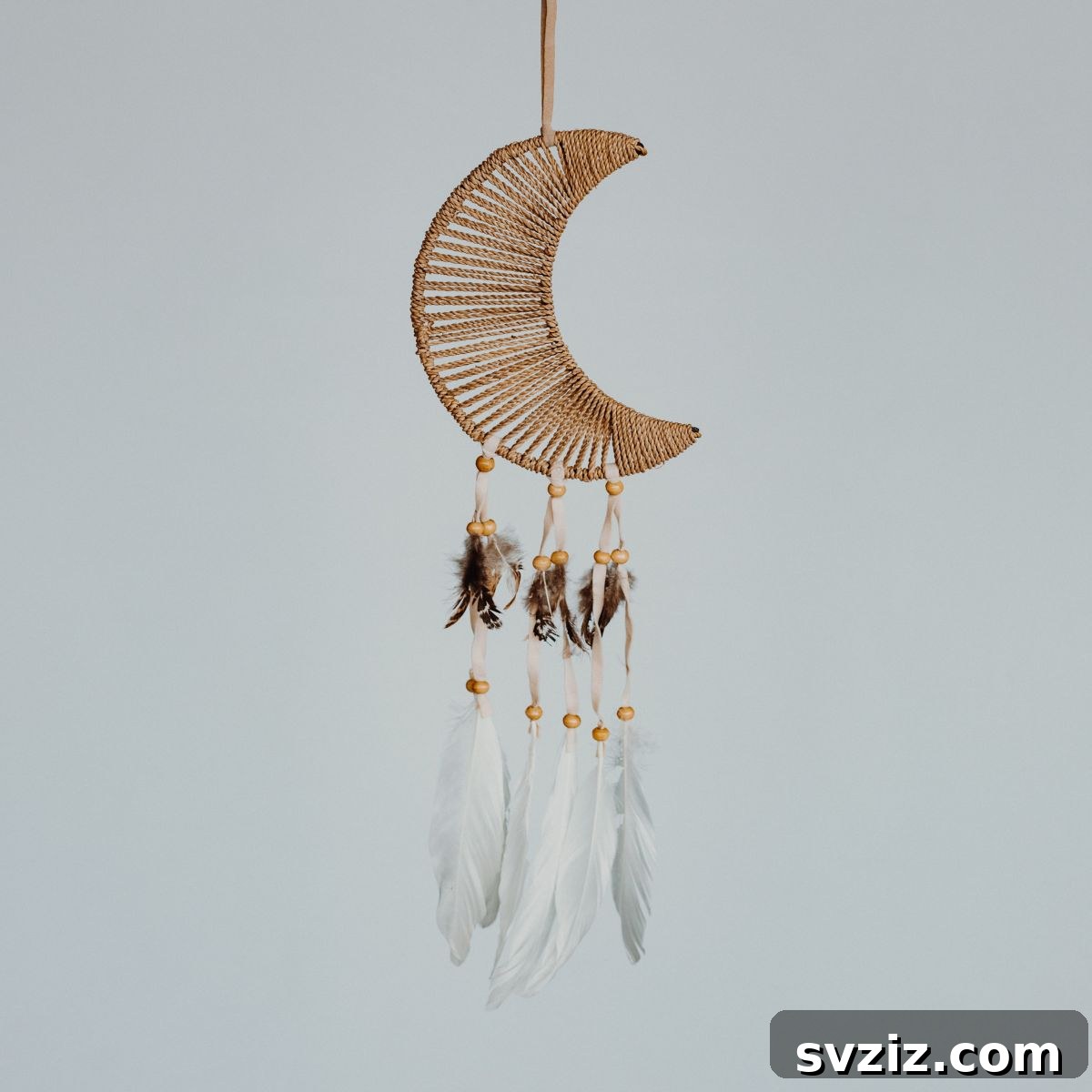 Create a Bohemian Oasis: Inspiring Wall Decor Ideas 23 DIY Crescent Moon Wall Hanging with Bohemian Accents