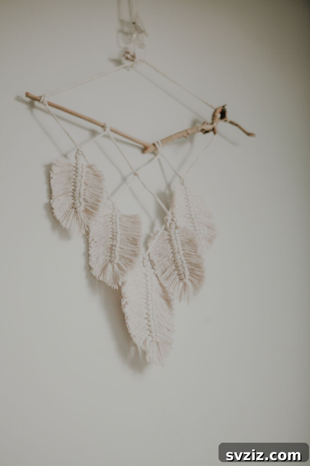 31 Bohemian Living Room Inspirations 28 Macrame Feathers Wall Hanging