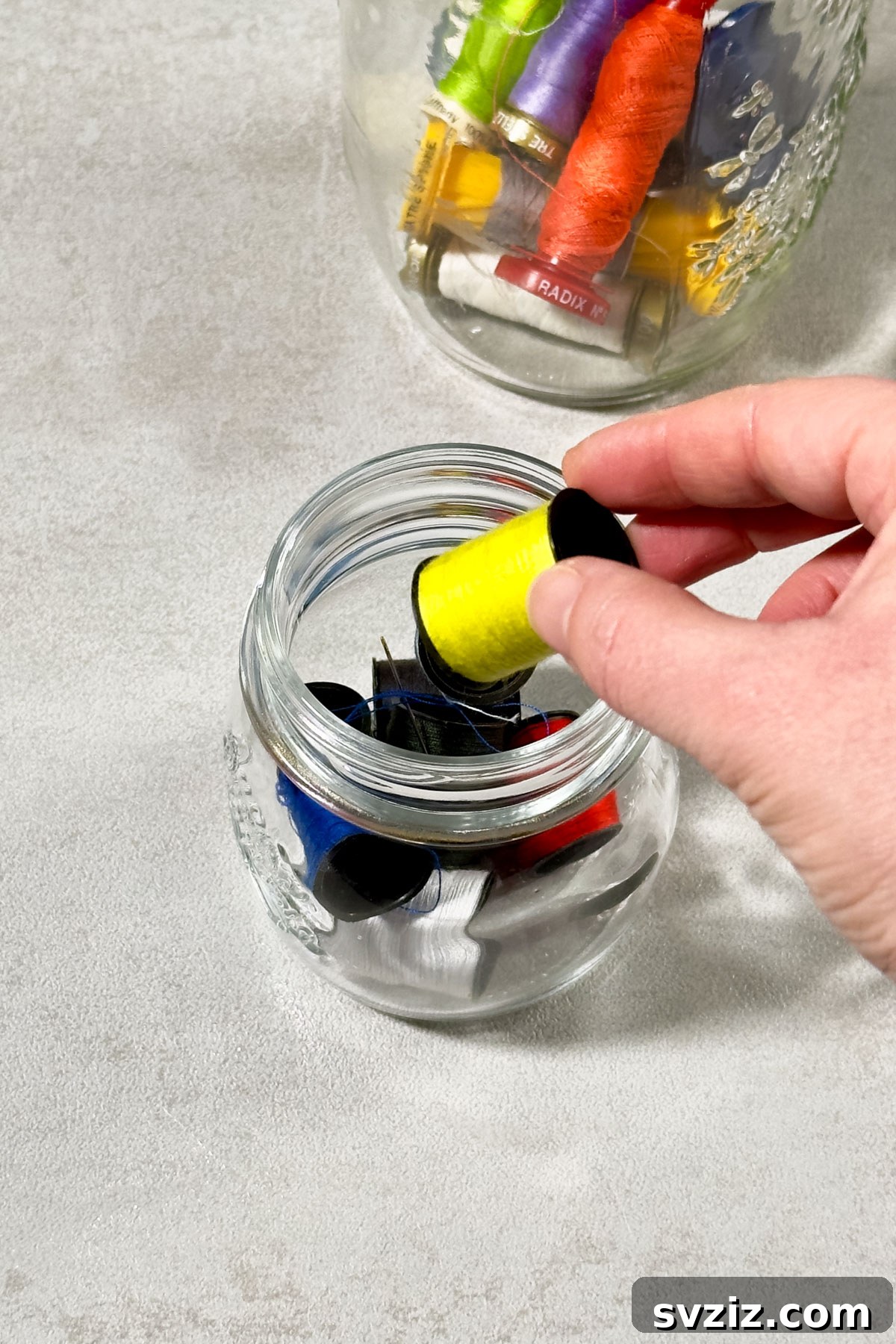 21 Clever Ways to Declutter Your Home Without Spending a Fortune 20 Use Glass Jars to Store Sewing Spools