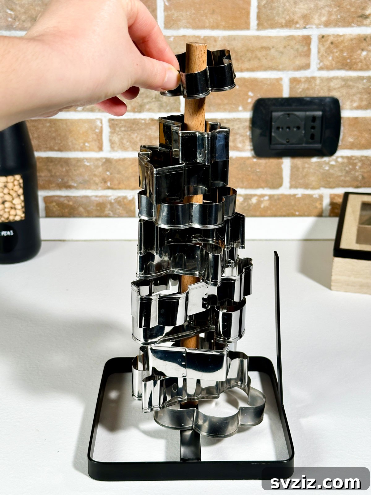 21 Clever Ways to Declutter Your Home Without Spending a Fortune 3 Use Paper Towel Holder to Store Cookie Cutters