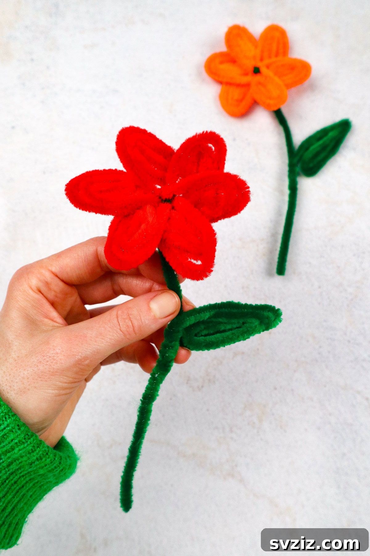 Fuzzy Floral Creations 2 A beautifully crafted pipe cleaner flower, showcasing its vibrant colors and intricate petal design.