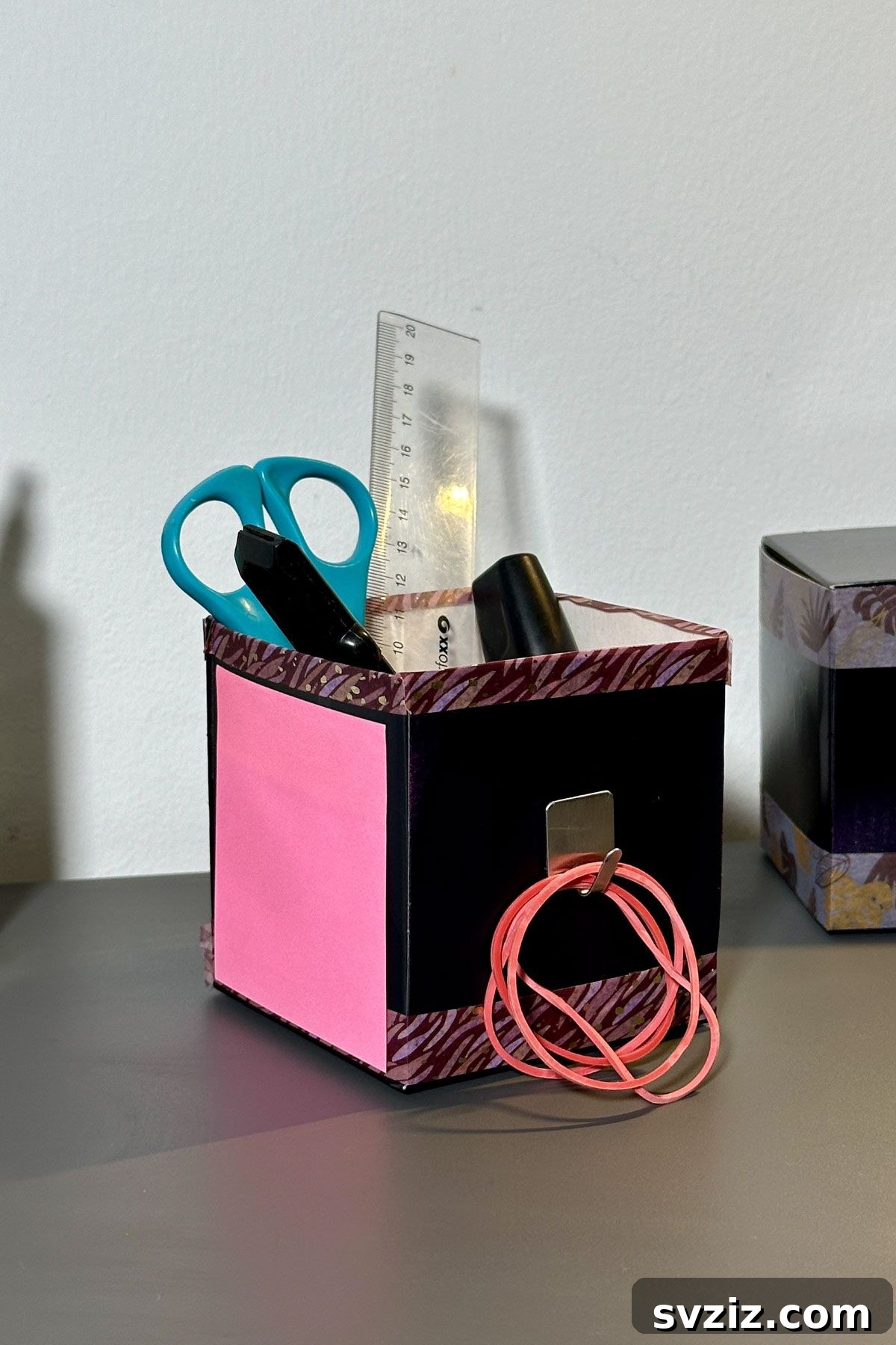 Creative repurposing of a coffee pod box into a stationary holder