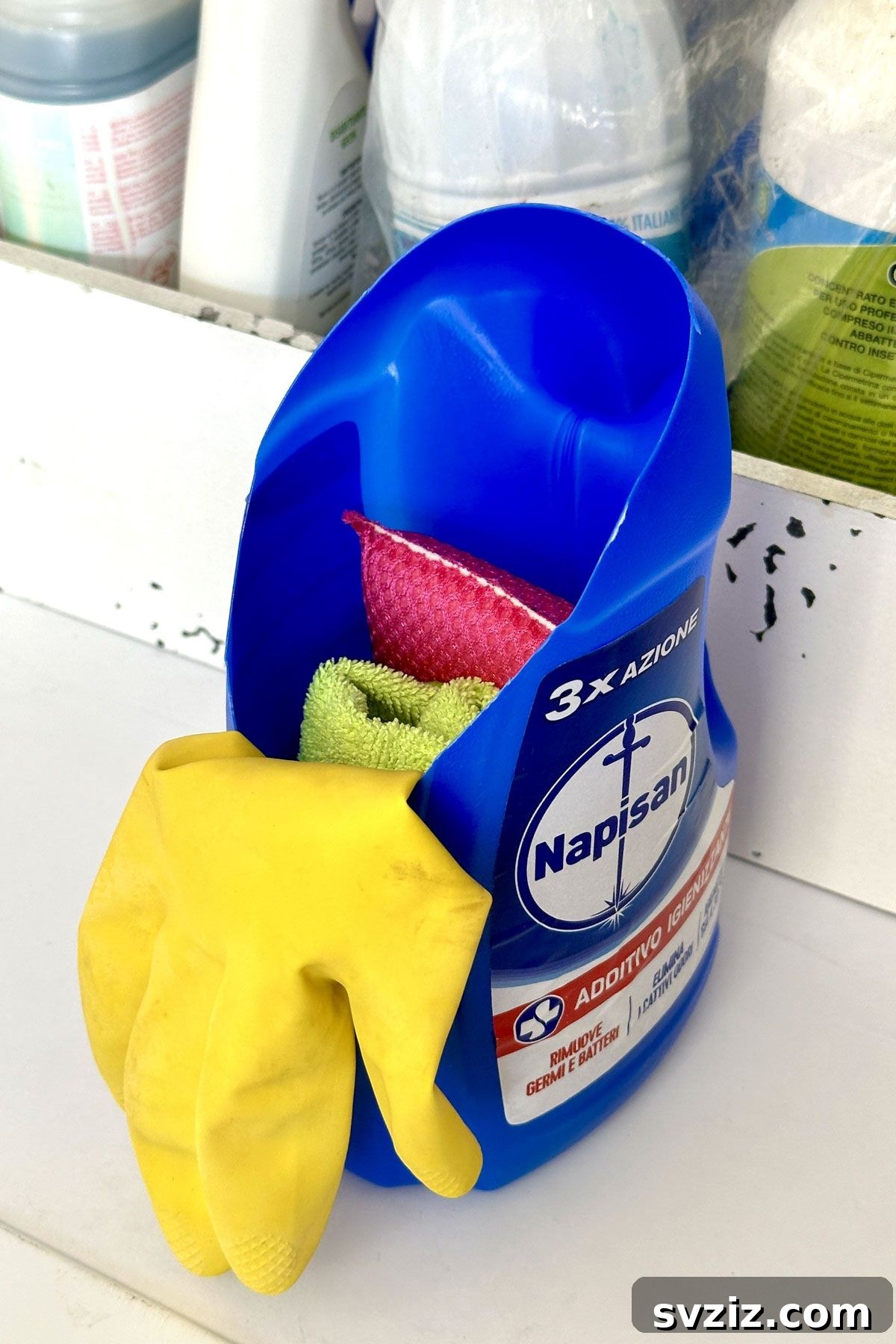 DIY storage solution: empty detergent bottle container for sponges and gloves