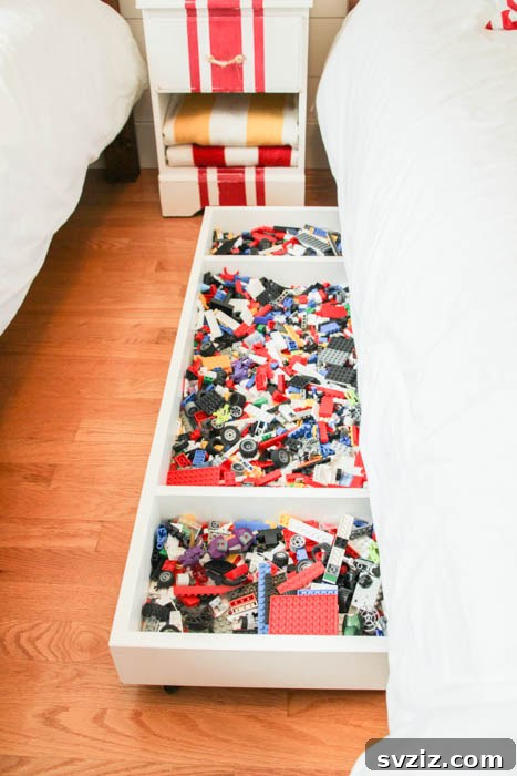 21 Ingenious Ways to Transform Small Bedrooms 14 Under-bed rolling storage carts provide easy access to organized belongings, a practical solution for maximizing space in small bedrooms.