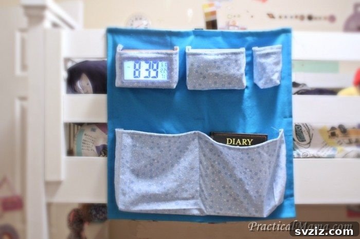 21 Ingenious Ways to Transform Small Bedrooms 4 A fabric bedside caddy offering convenient storage for books, remotes, and phones, perfect for small bedrooms without nightstands.