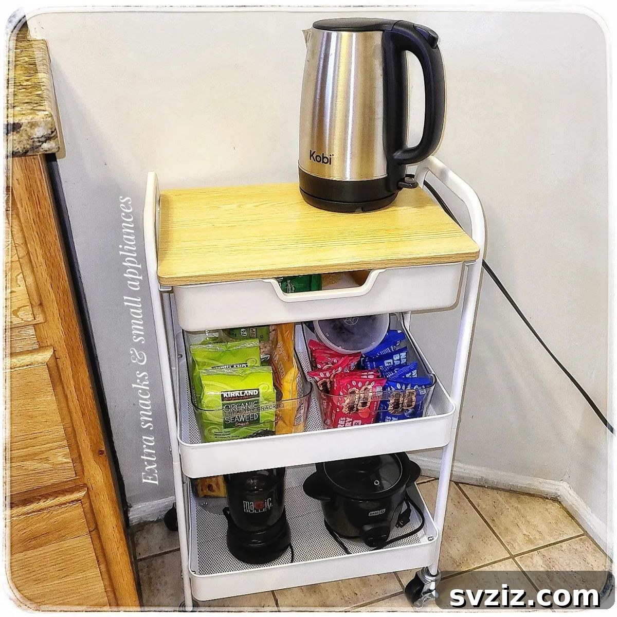 IKEA cart storing various kitchen appliances like a blender and food processor