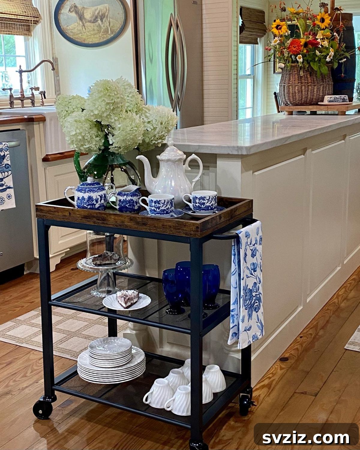 IKEA cart set up as a charming tea party cart with teacups, teapot, and snacks