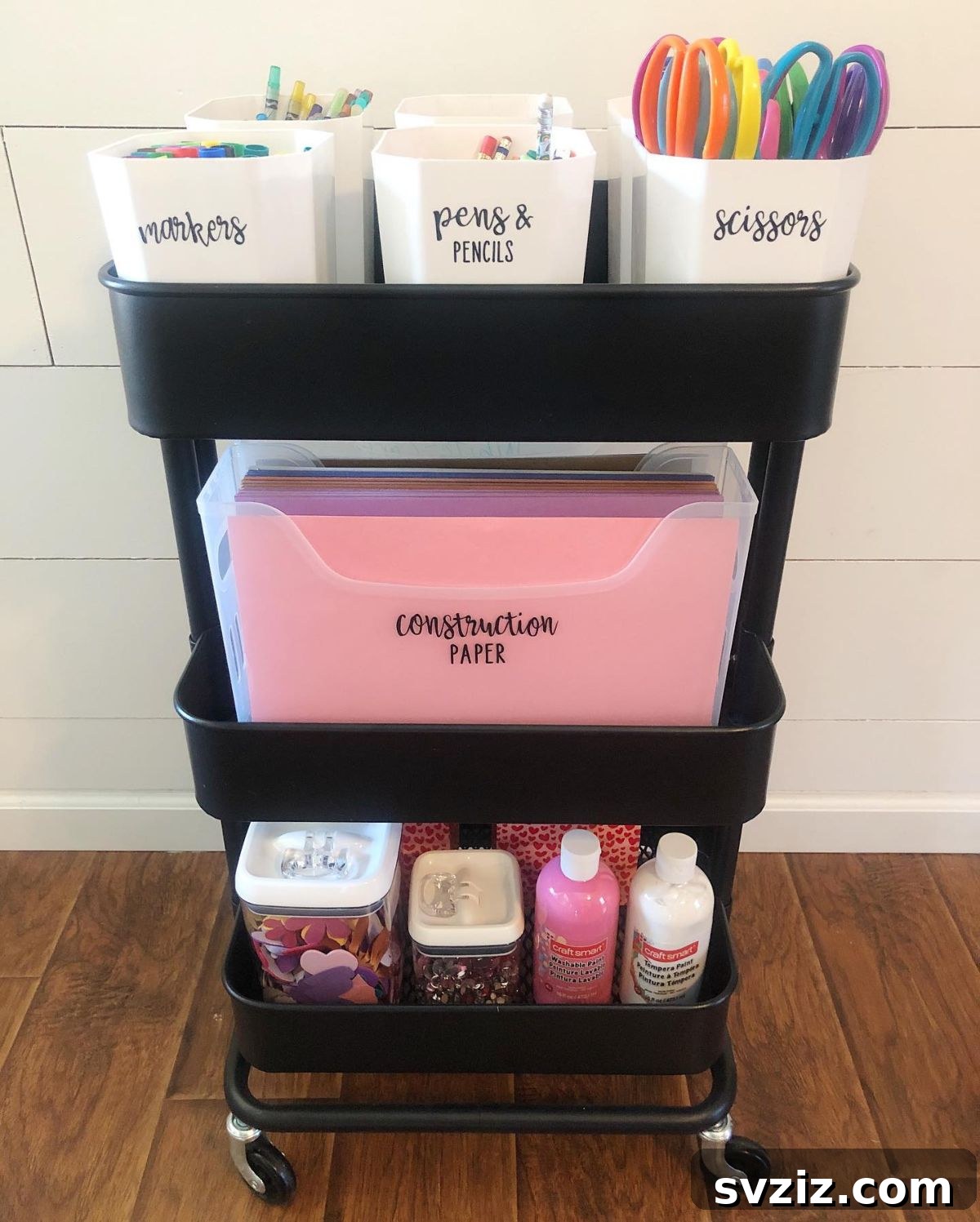 IKEA cart filled with various craft supplies like yarn, paints, and tools