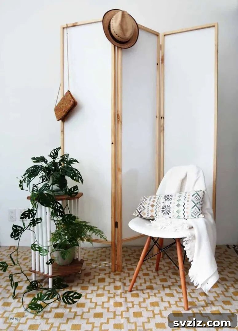 Smart Space Solutions for Couples Bedrooms 18 Elegant DIY modern room divider separating distinct areas within a small open-plan bedroom, providing privacy and organization.