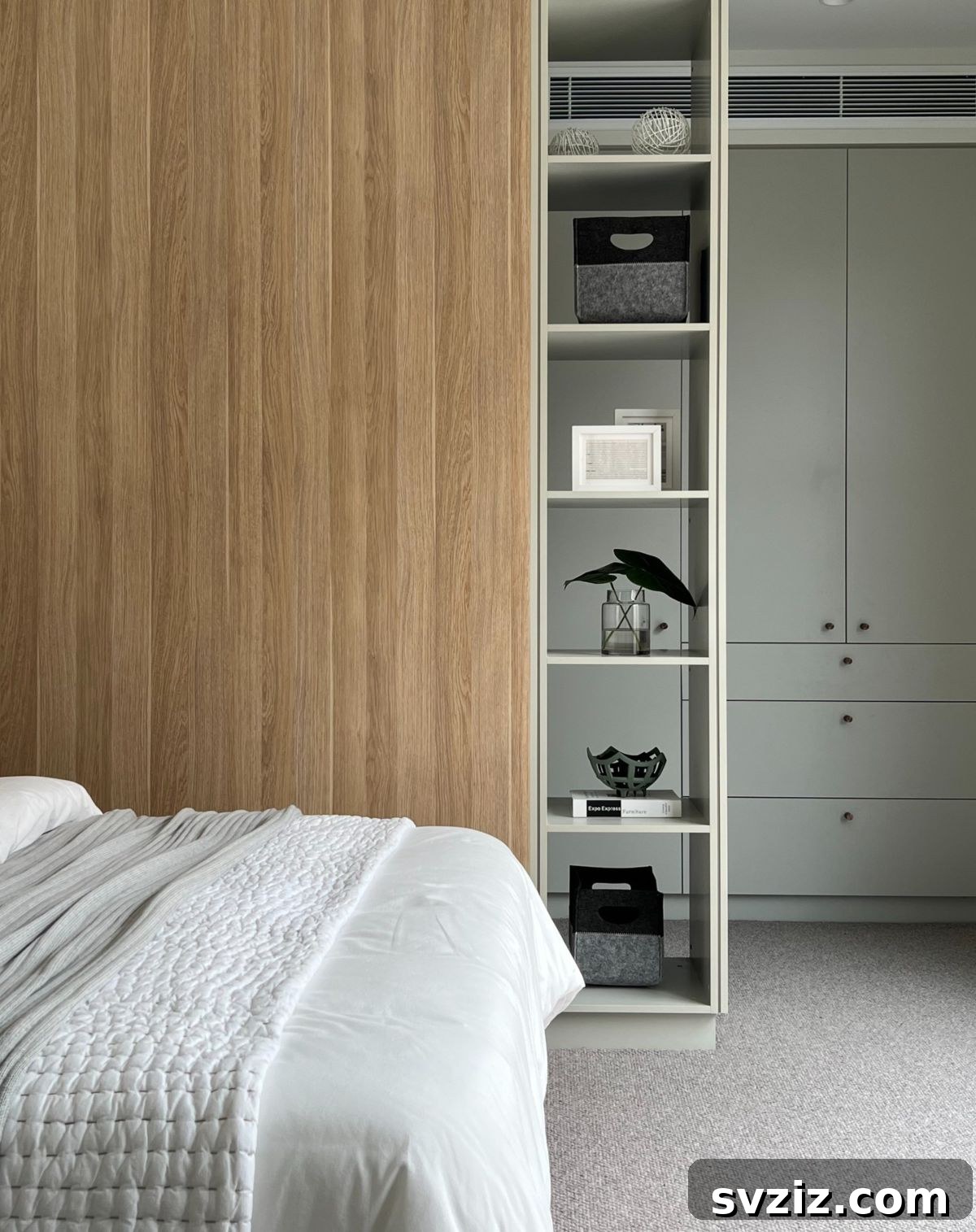 Smart Space Solutions for Couples Bedrooms 3 Elegant open shelving in a small bedroom for couples, showcasing decorative items and books, creating a spacious and accessible storage solution.