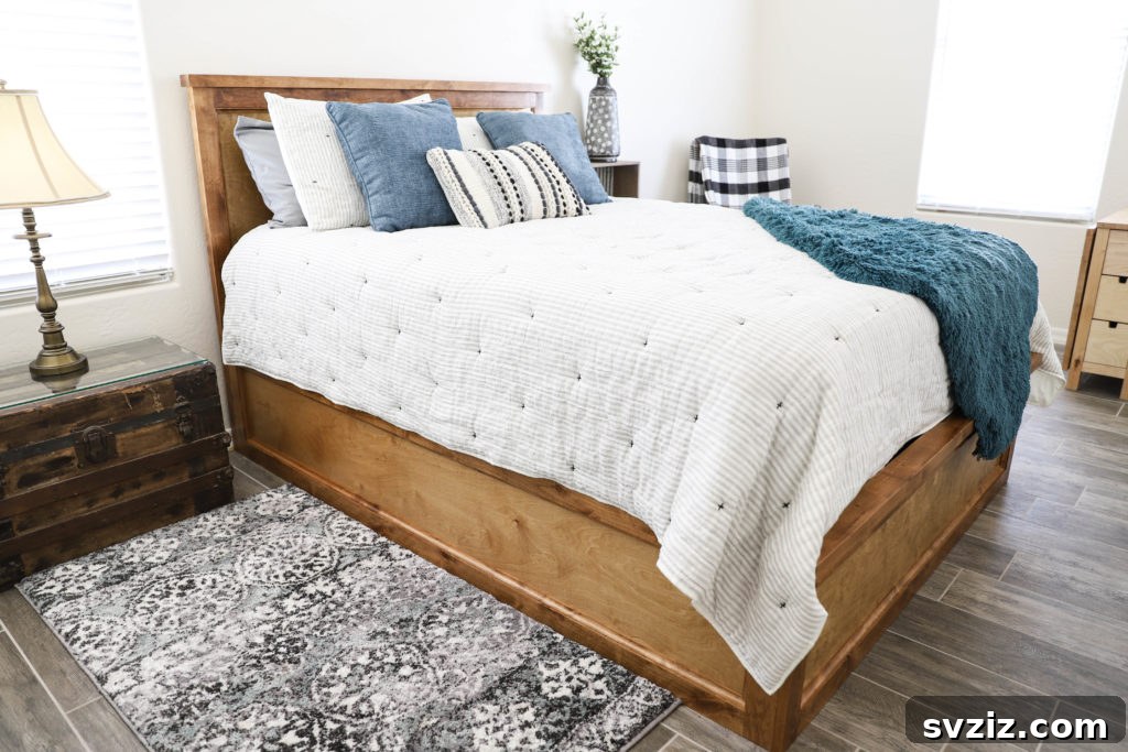 Smart Space Solutions for Couples Bedrooms 21 Elegant storage bed with integrated drawers, providing ample hidden space for clothes and linens, enhancing the functionality and neatness of a small bedroom.