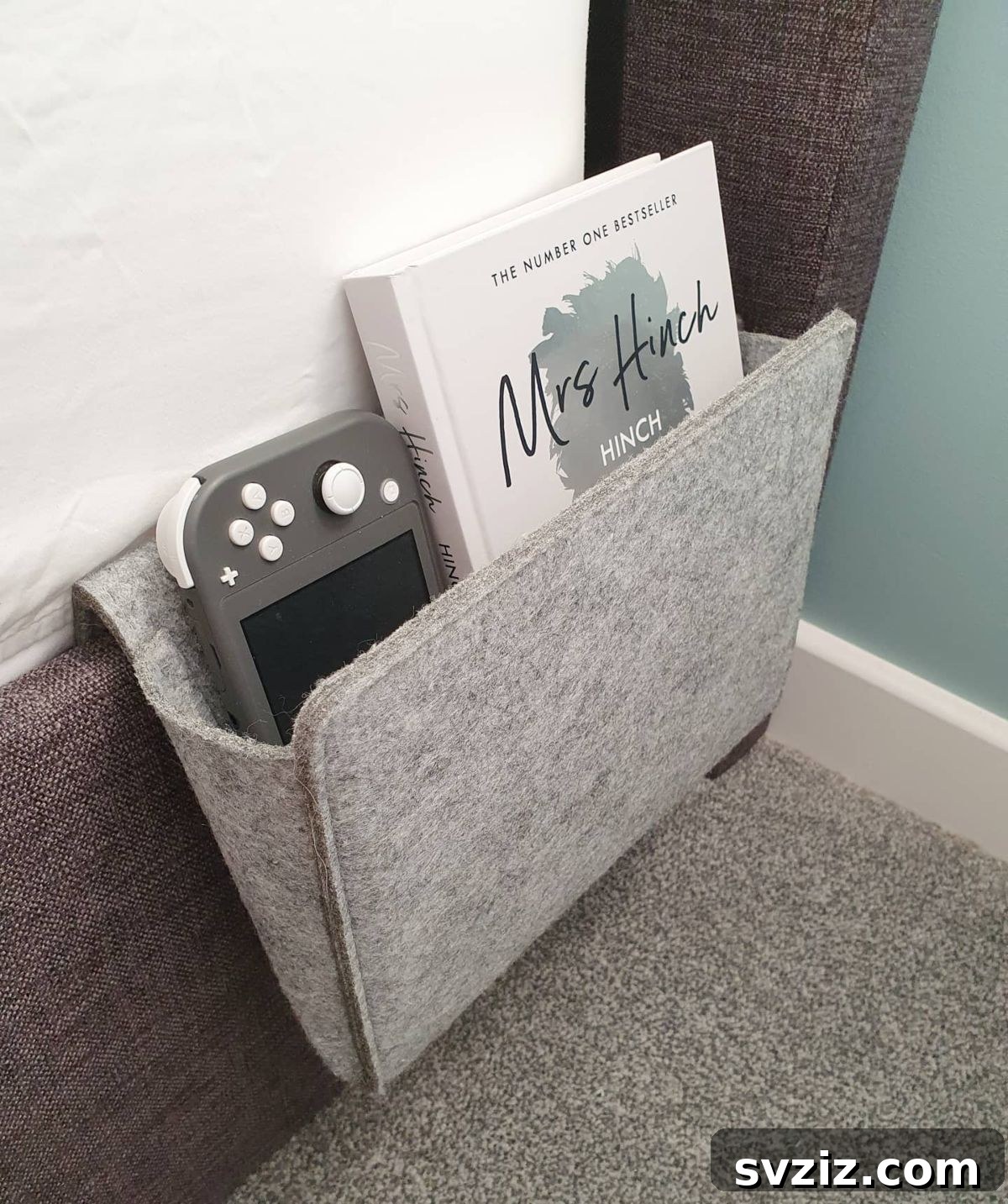 Smart Space Solutions for Couples Bedrooms 29 Practical bedside caddy hanging from the bed frame, holding a book, phone, and remote control, freeing up space on the nightstand.