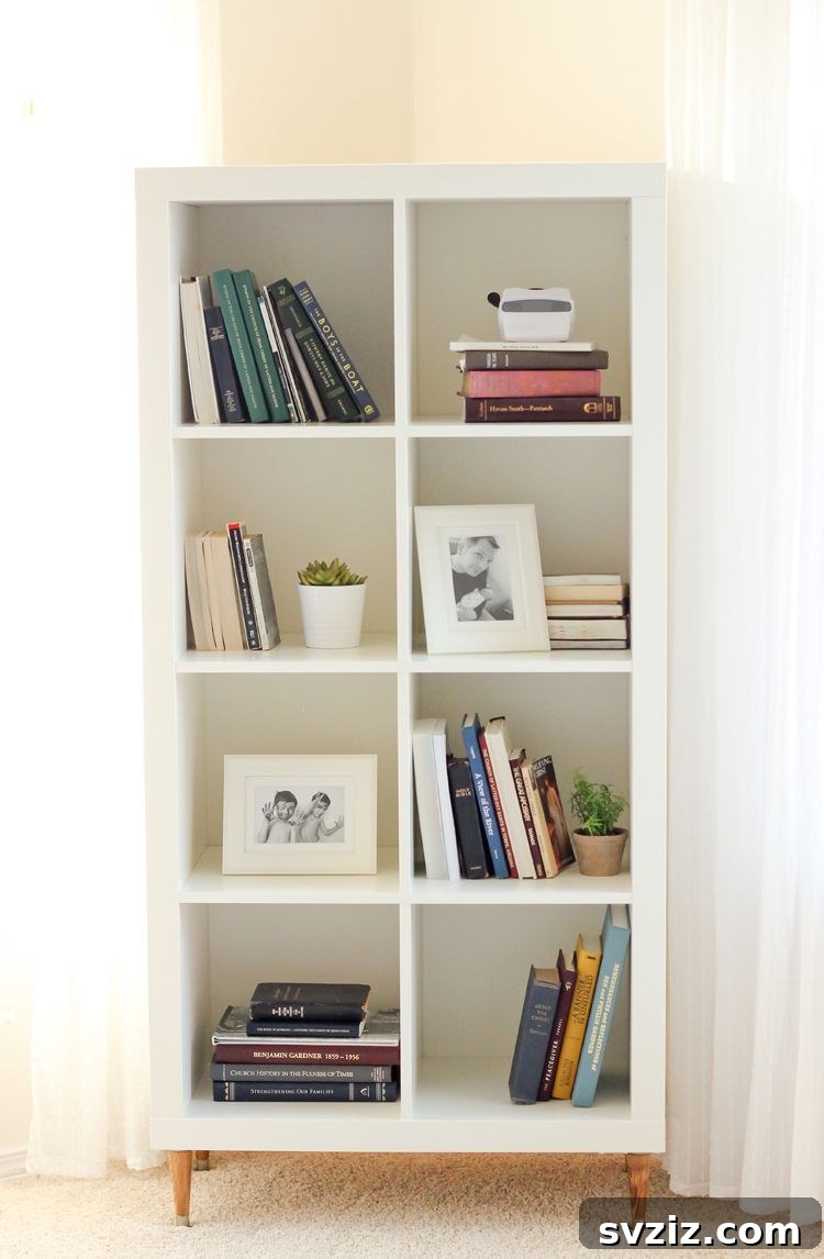 Smart Space Solutions for Couples Bedrooms 10 Versatile IKEA Kallax storage unit displaying books and personalized decor, doubling as a room divider or a wall unit in a small bedroom.