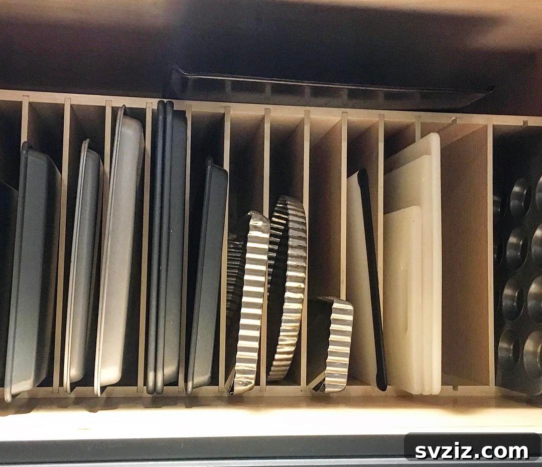 31 Genius Vertical Storage Hacks 17 Custom inserts for vertical bakeware storage in a kitchen cabinet
