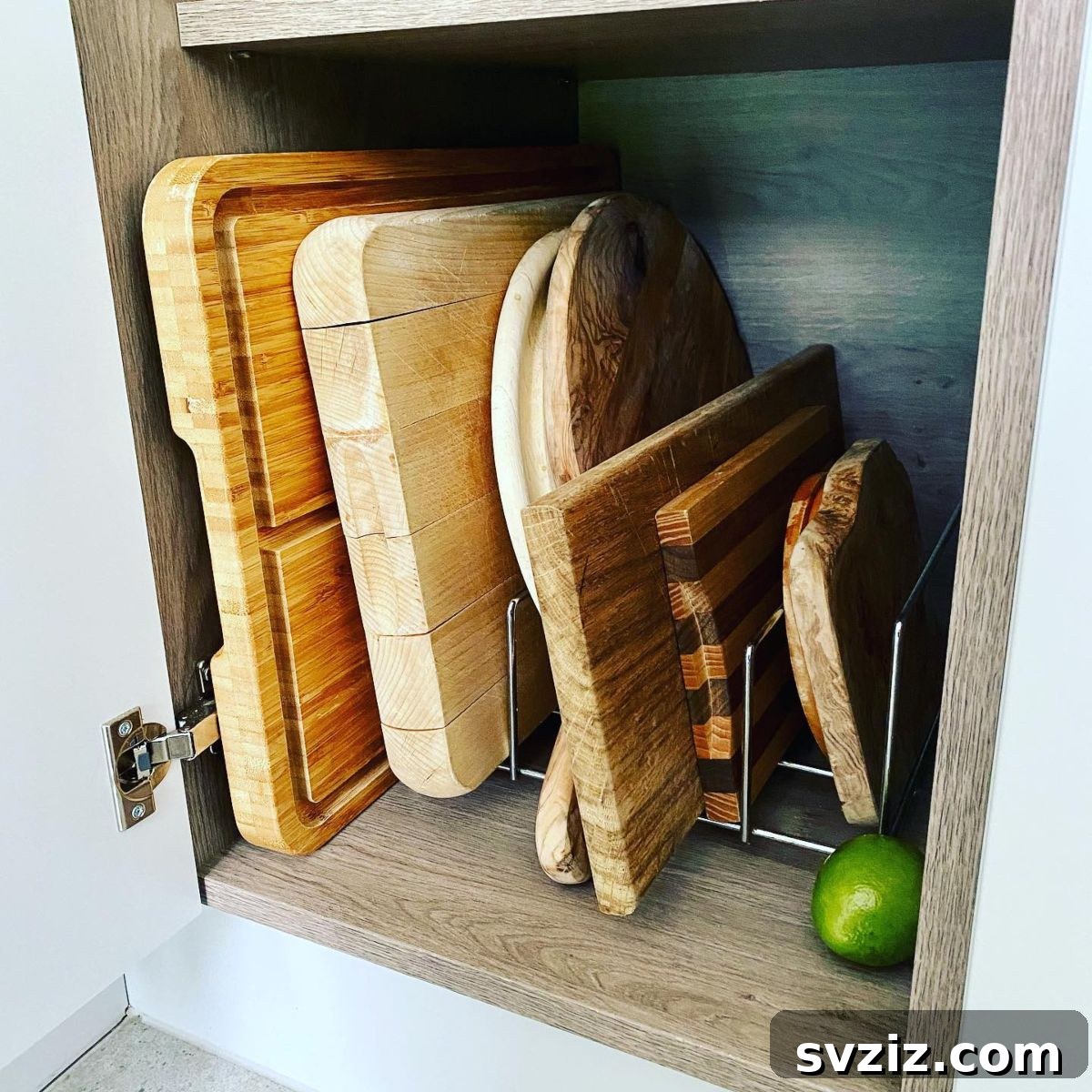 31 Genius Vertical Storage Hacks 27 Metal bakeware stand organizing chopping boards and baking sheets vertically