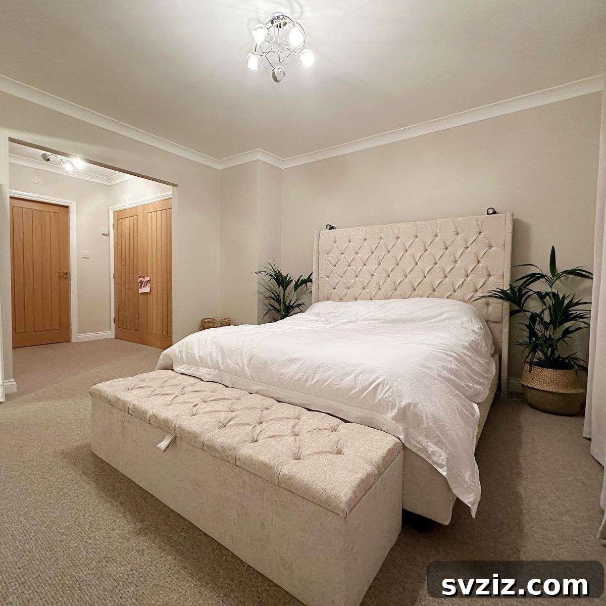 Effortless Bedroom Organization for a Clutter-Free Sanctuary 16 A stylish foot-of-the-bed storage ottoman provides hidden storage for blankets and pillows while adding elegance and seating.