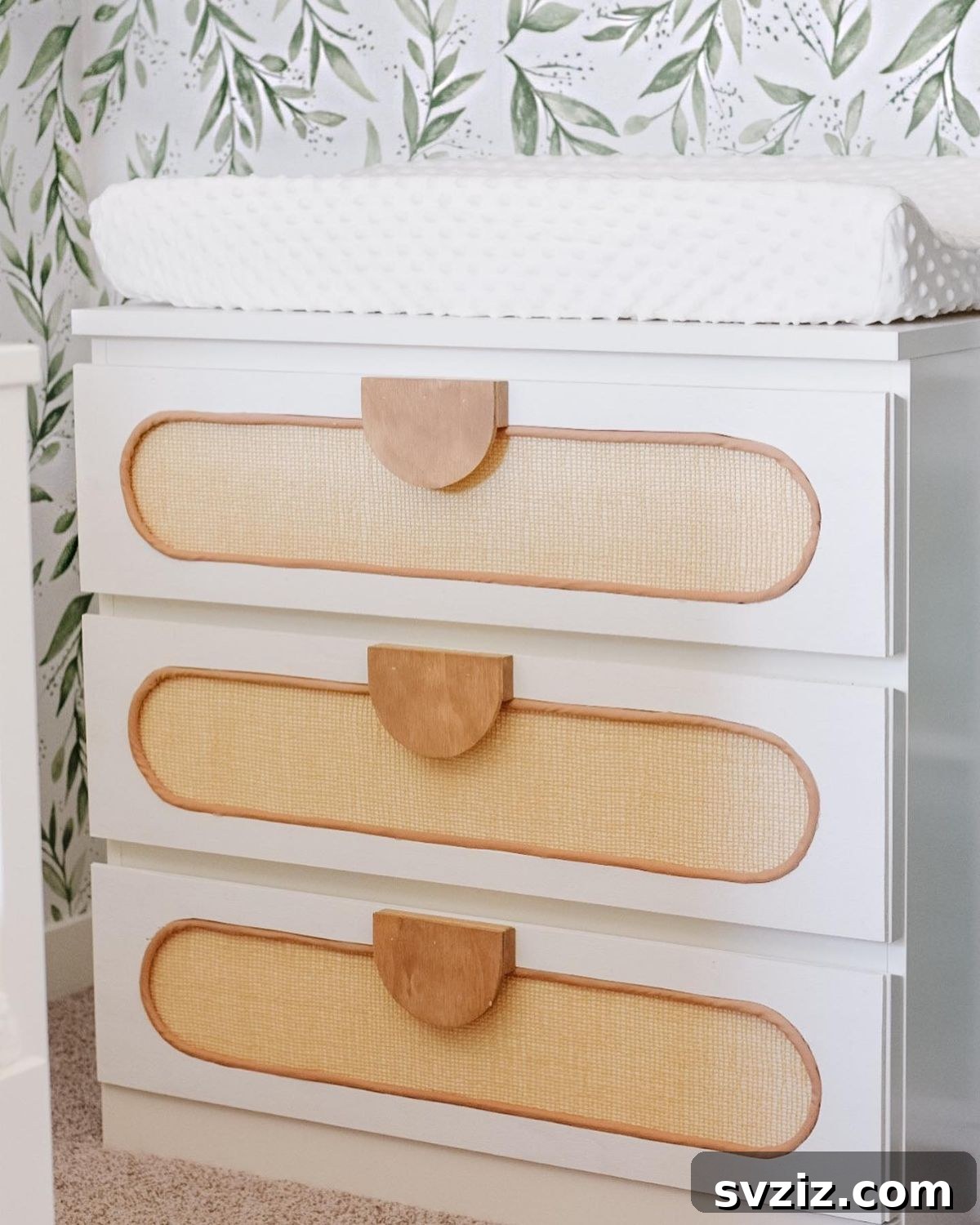 21 Genius IKEA Transformations for Your Home 13 IKEA Malm dresser customized with unique drawer fronts and handles for a nursery