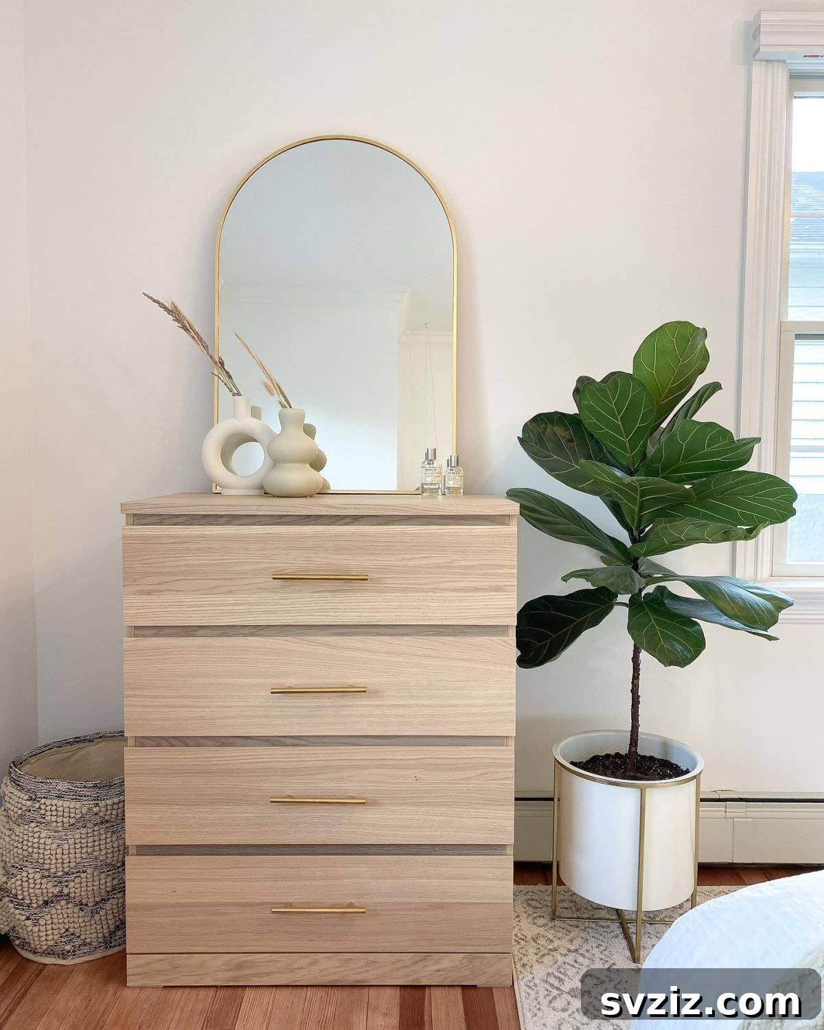 21 Genius IKEA Transformations for Your Home 19 IKEA Malm dresser upgraded with gold drawer pulls and minimalist decor