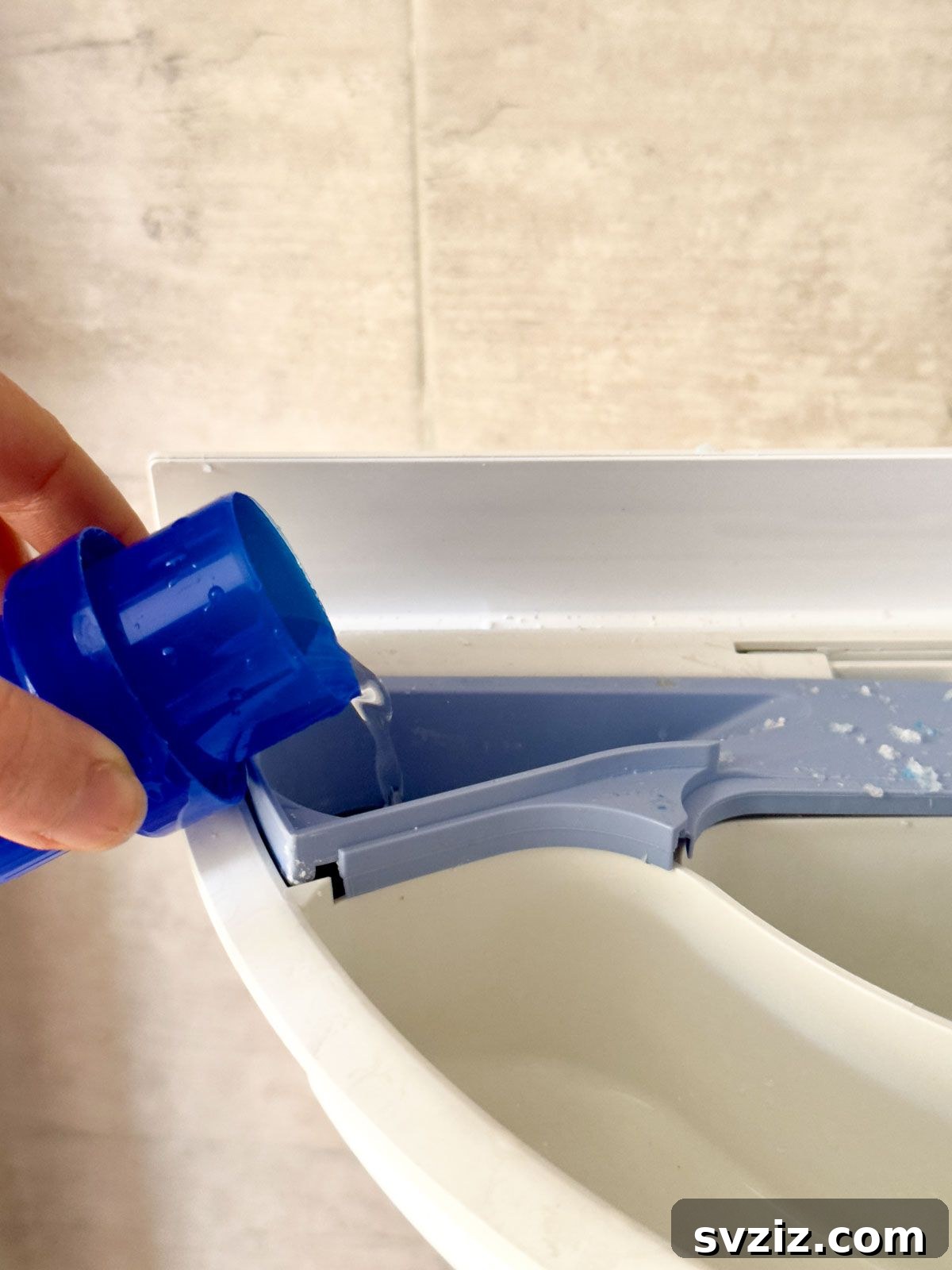 Homemade fabric softener recipe with baking soda, vinegar, essential oils