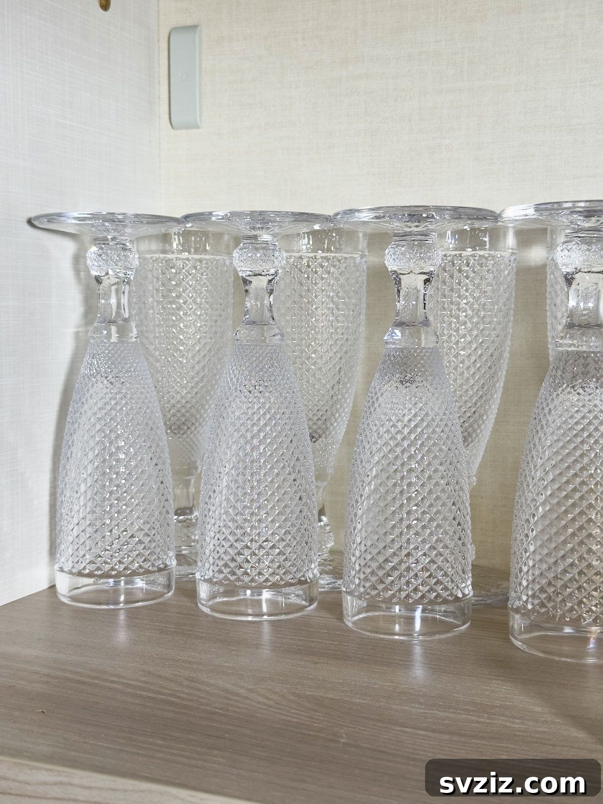 Turn the Stem Glasses Upside Down so That They Take Up Less Space - clever cabinet organization for glassware