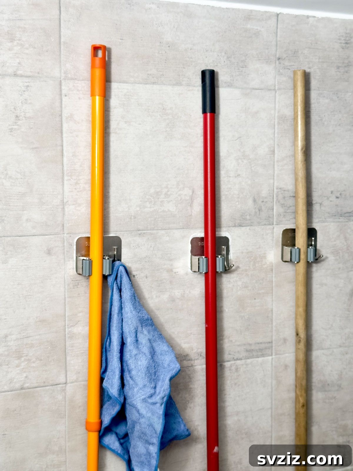 Attach Broom Holders to a Wall - smart utility room organization