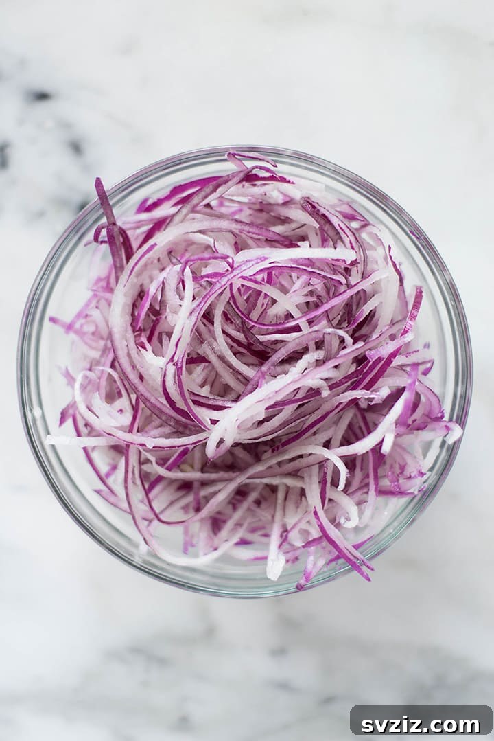 Thinly cut onion with spiralizer for salads and stir-fries