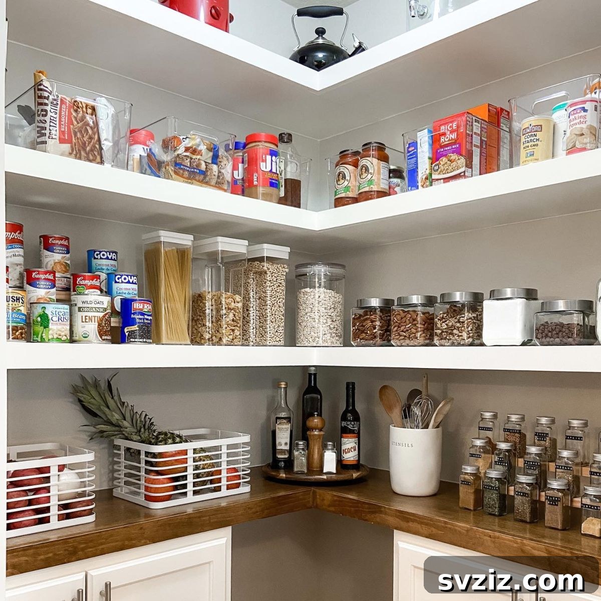 Clear acrylic bins for a modern, organized pantry look.