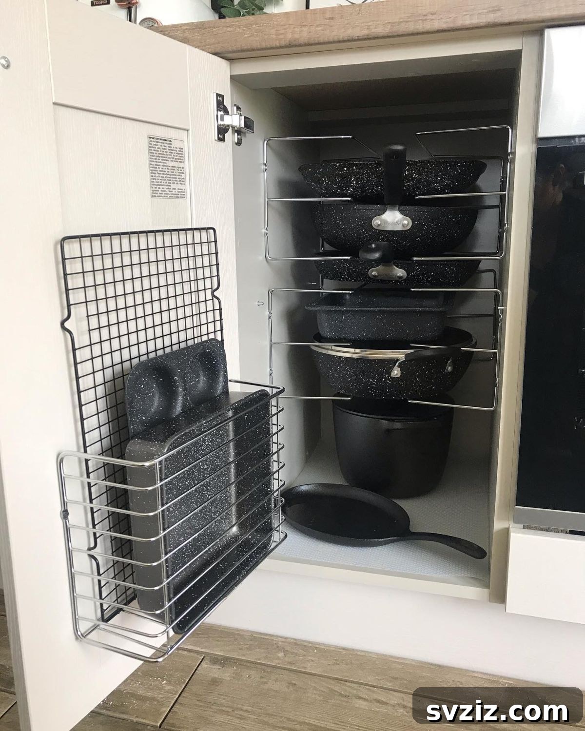 Vertical pan rack organizing pots and lids in a cabinet