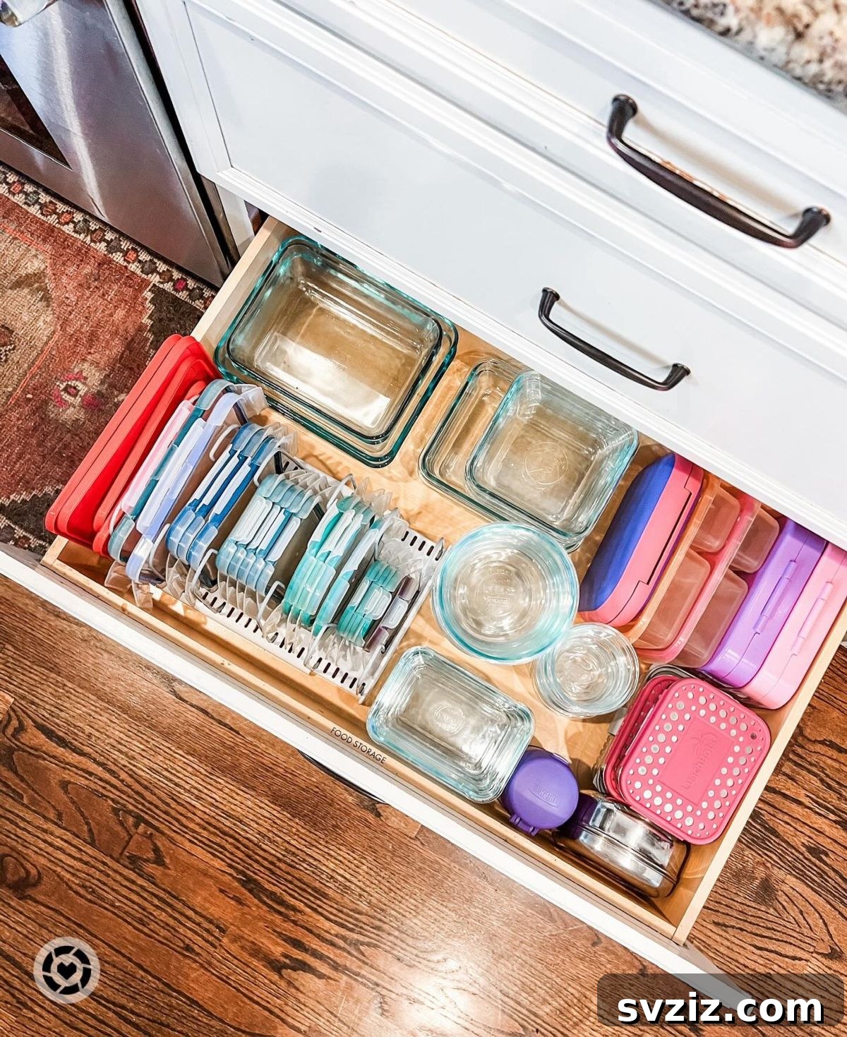Neatly organized food storage containers and lids in a drawer