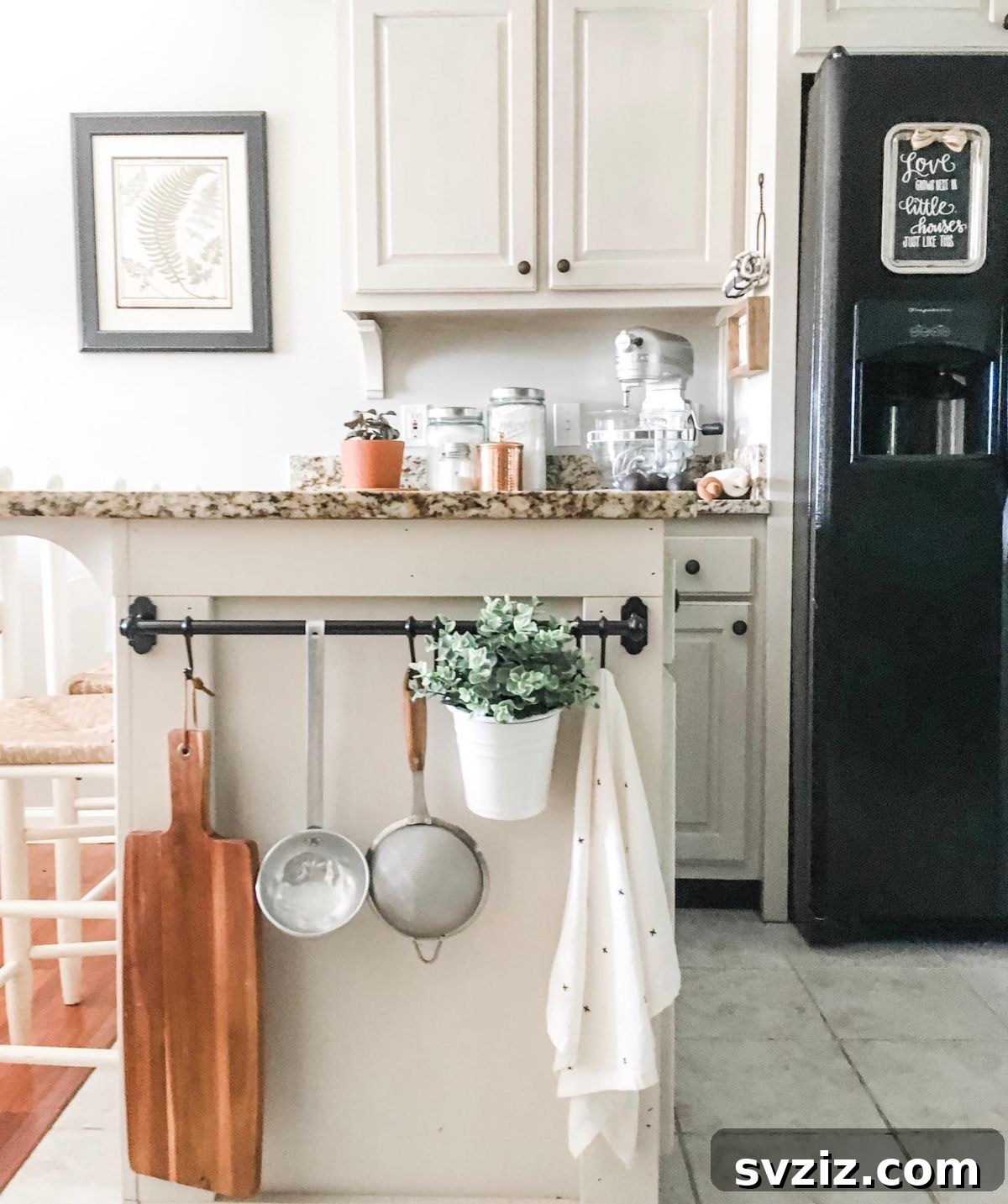 Attach a storage rail to the side of a kitchen island to hang towels, utensils, or small baskets, maximizing often-unused space.