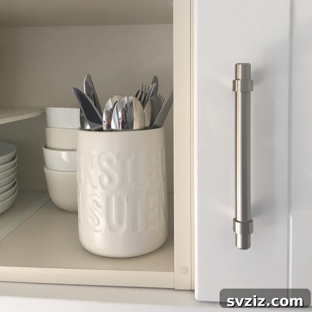 Keep cooking utensils organized and accessible in a decorative utensil pot on the countertop or inside a cabinet.
