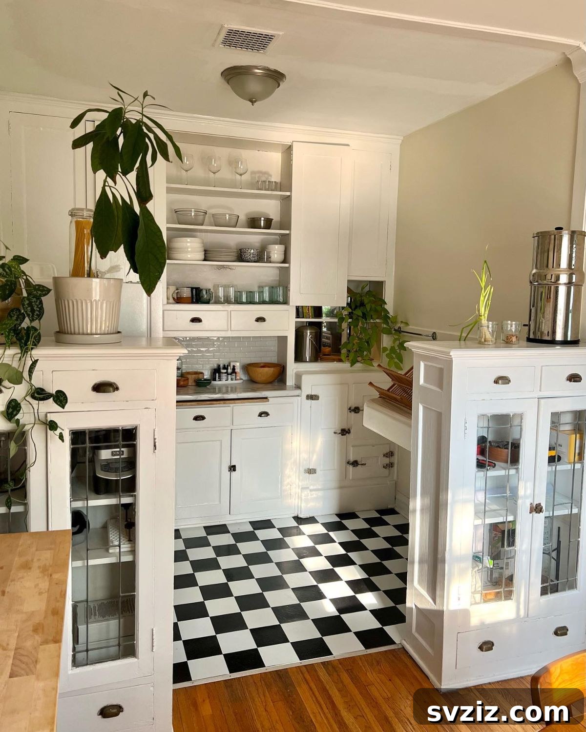 Enhance a small kitchen with DIY built-in cabinets, combining open shelves and closed storage for elegance, charm, and maximized space.