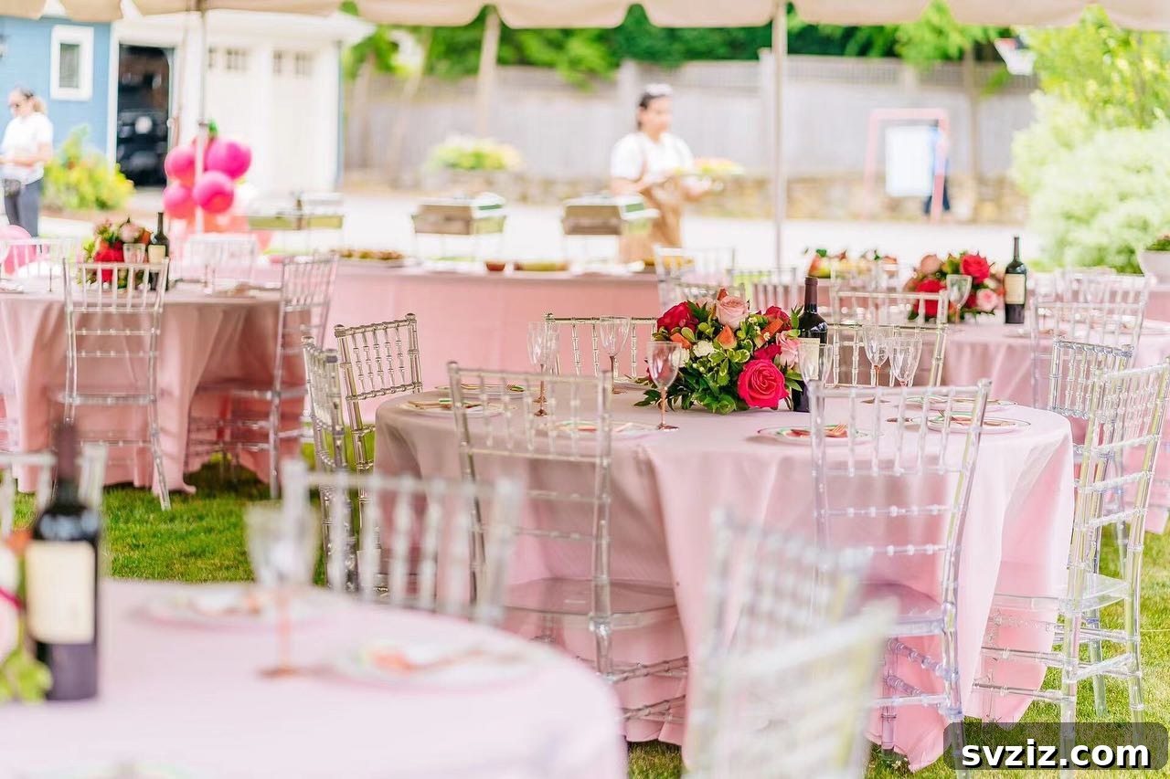 27 Elegant Round Table Wedding Centerpiece Inspirations 21 Vibrant bright pink floral centerpieces contrasted with baby pink tablecloths for an outdoor wedding.