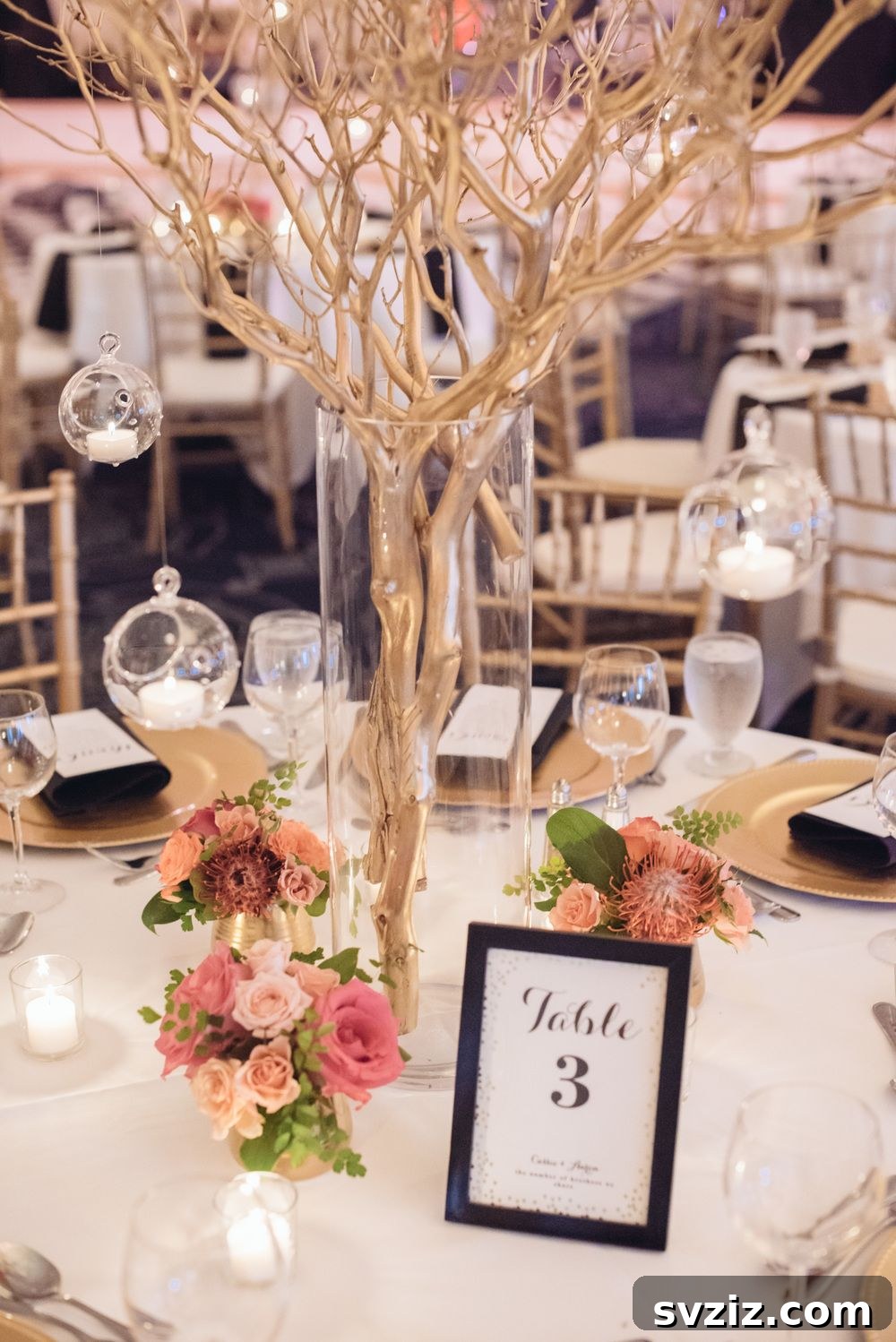 27 Elegant Round Table Wedding Centerpiece Inspirations 27 Unique wedding centerpiece featuring huge bare branches in tall glass vases for a rustic theme.