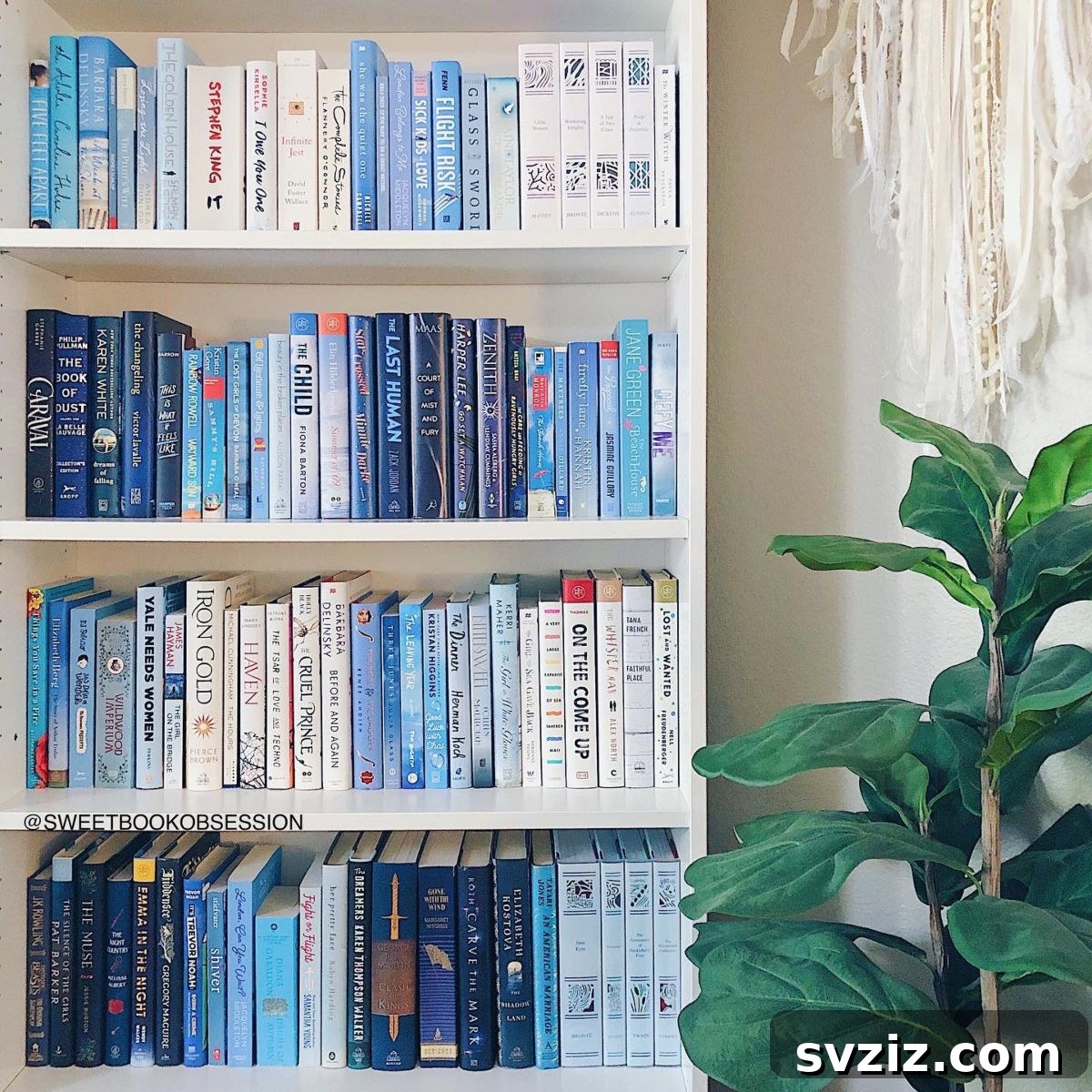 Bookshelf filled with blue-covered books, creating a serene and calming aesthetic.