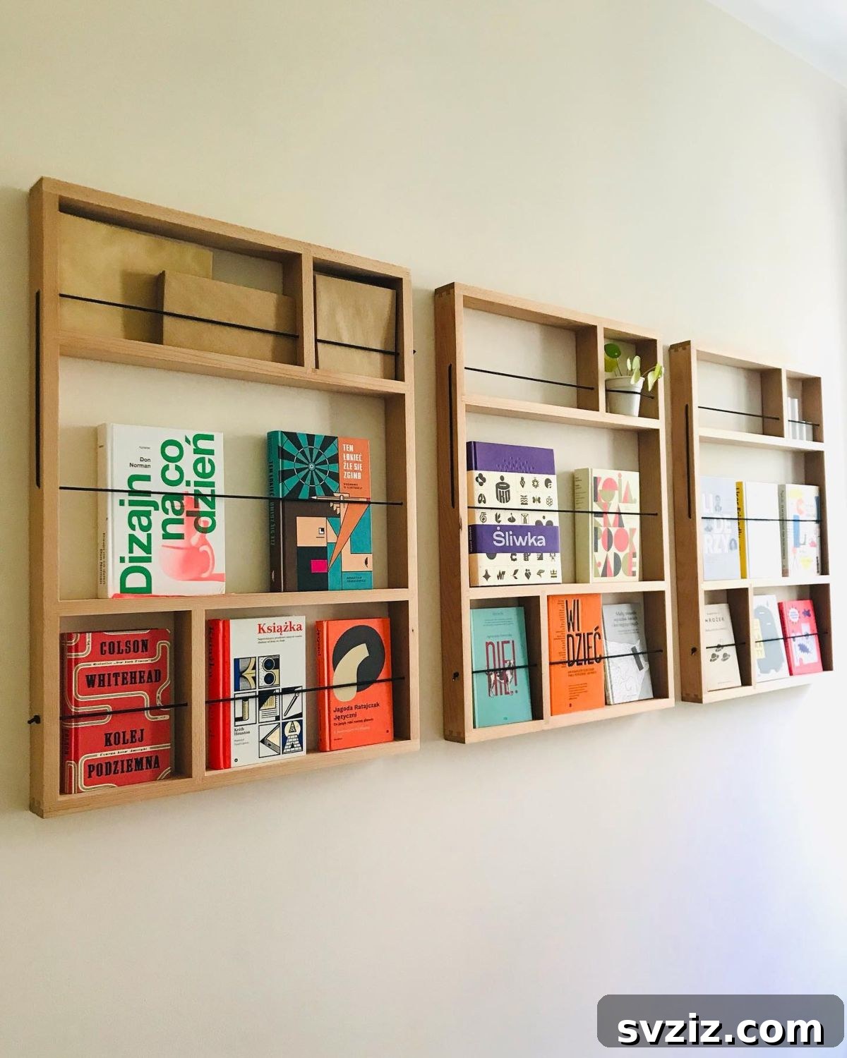 Wall-mounted bookshelves displaying book covers outwards, creating an attractive literary art display.