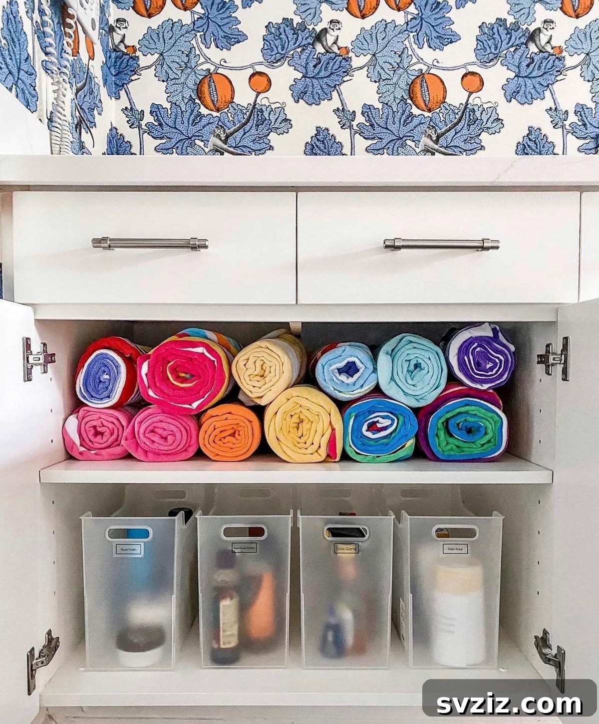 Genius Ways to Maximize Your Under Bathroom Sink Space 13 Tidy Towels and Clear Bins for coordinated bathroom storage