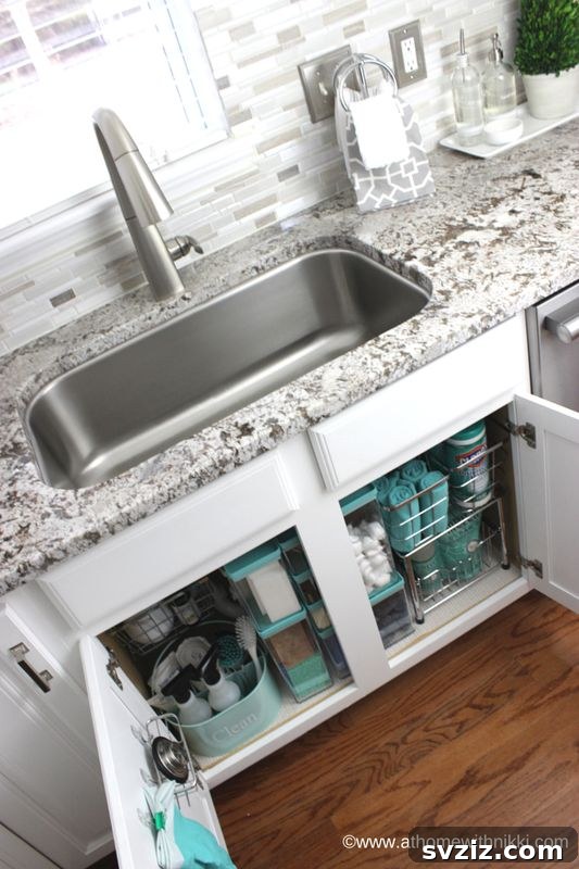 21 Genius Tricks to Tame Kitchen Clutter 11 Under kitchen sink organized with various baskets for cleaning supplies