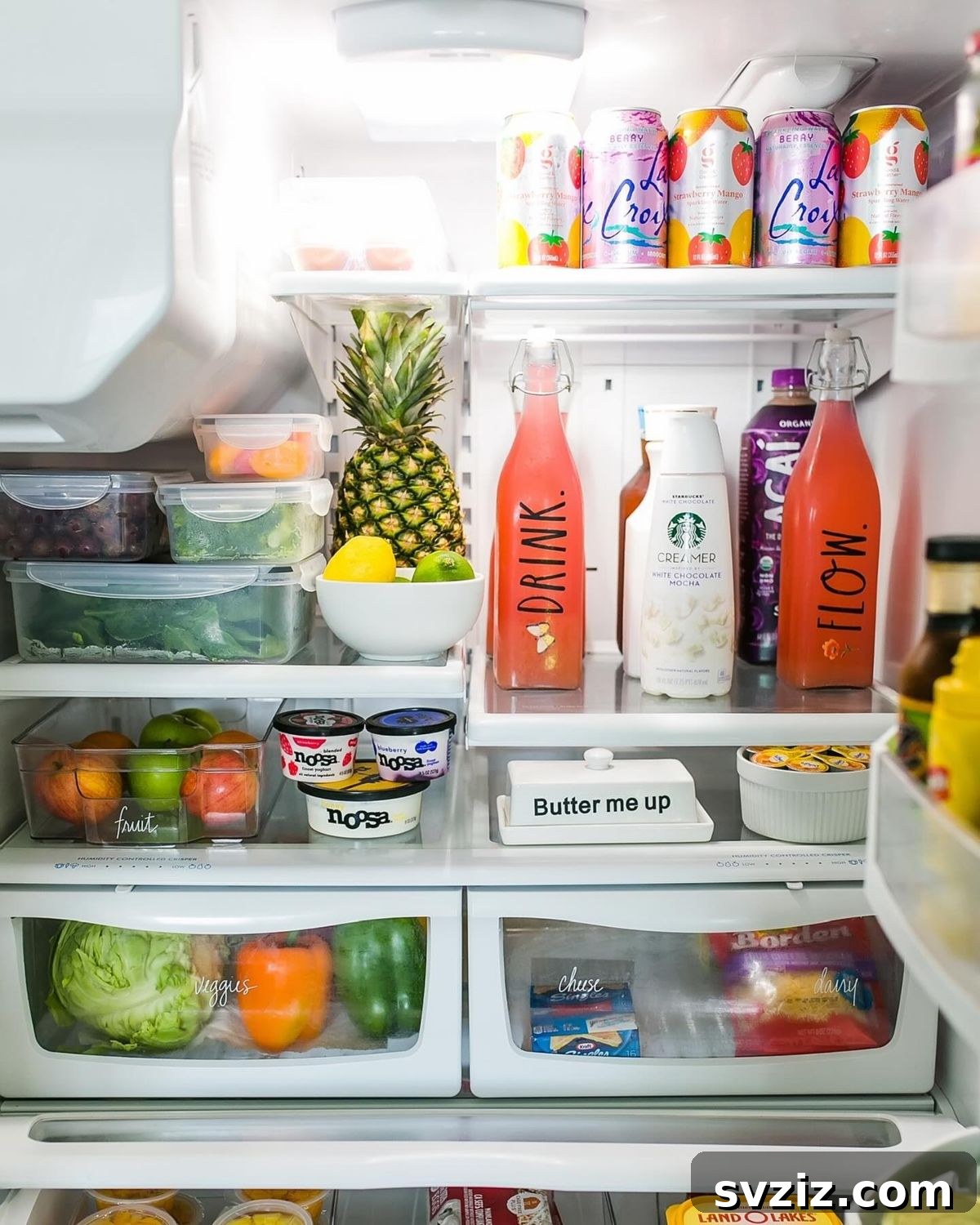 21 Genius Tricks to Tame Kitchen Clutter 12 Refrigerator interior organized with similar items grouped in clear bins